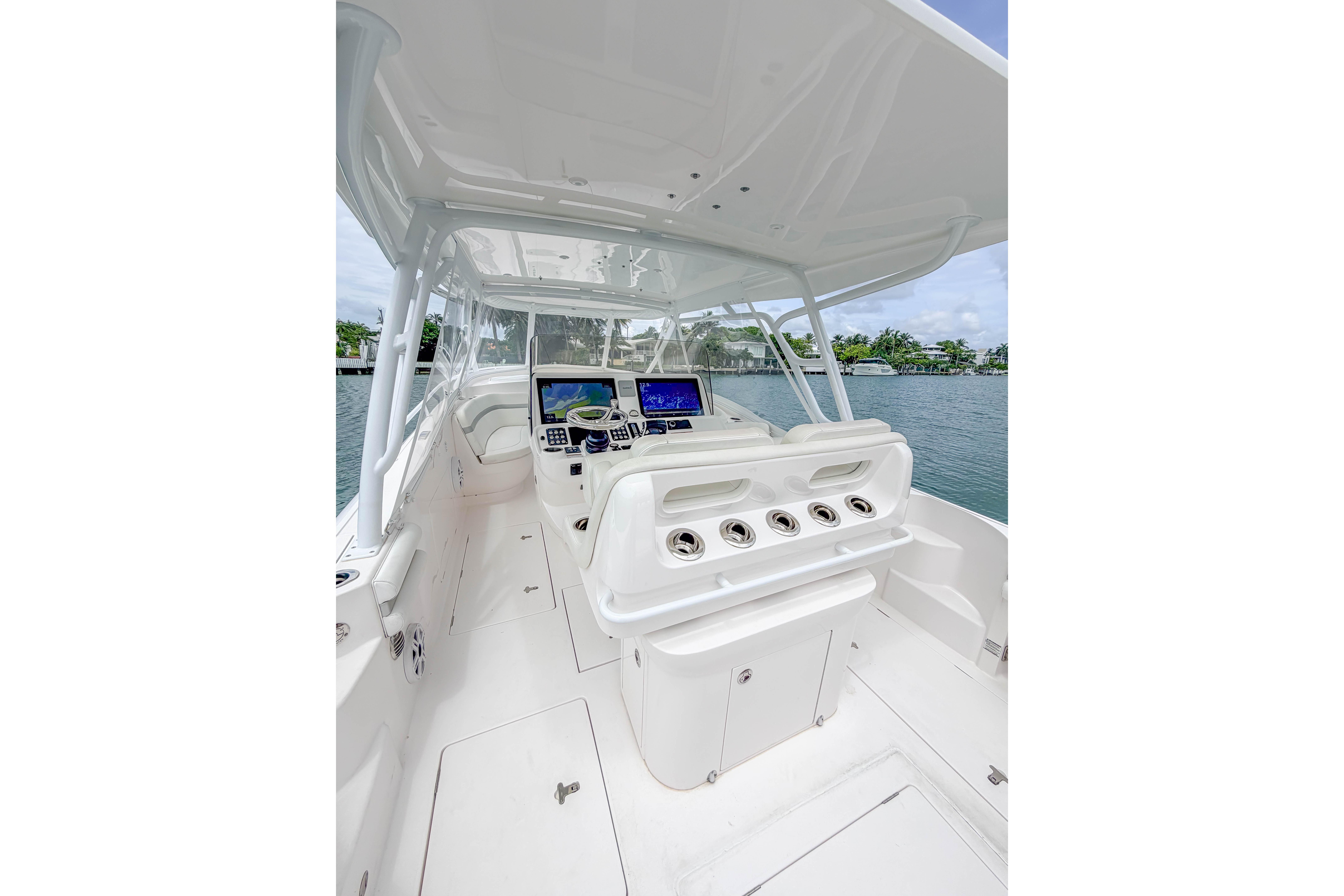 2021 Intrepid 409 Valor boat cockpit with modern navigation systems and sleek design.