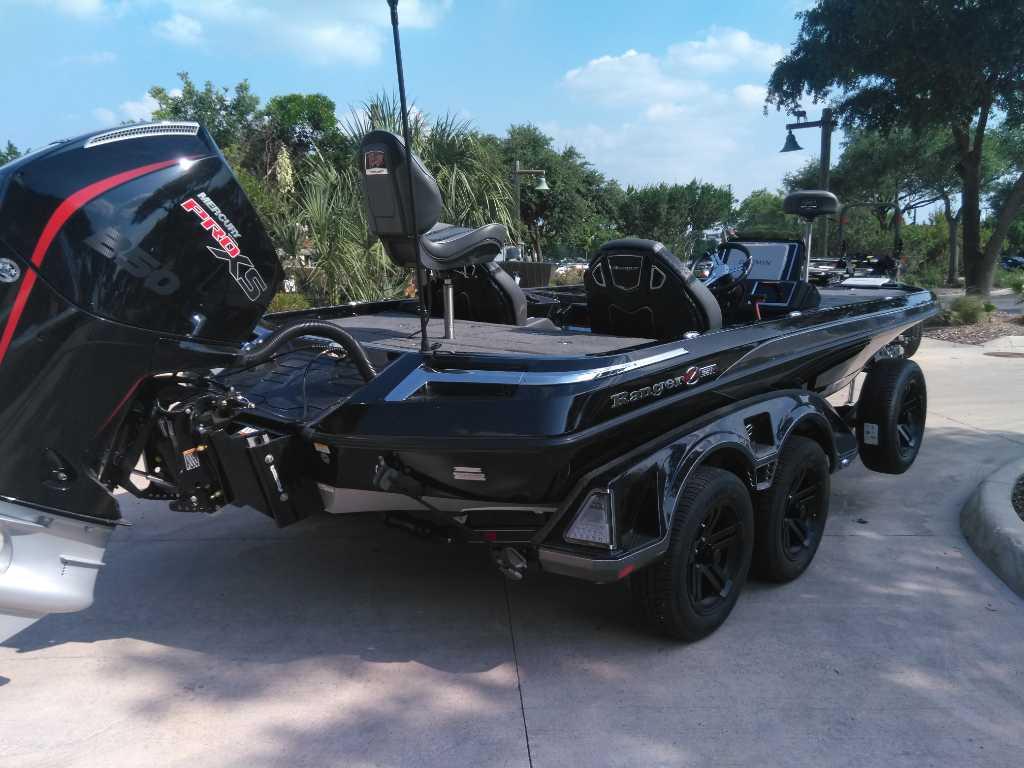 2025 Ranger Z521R Cup-Equipped boat with powerful engine, parked outdoors.