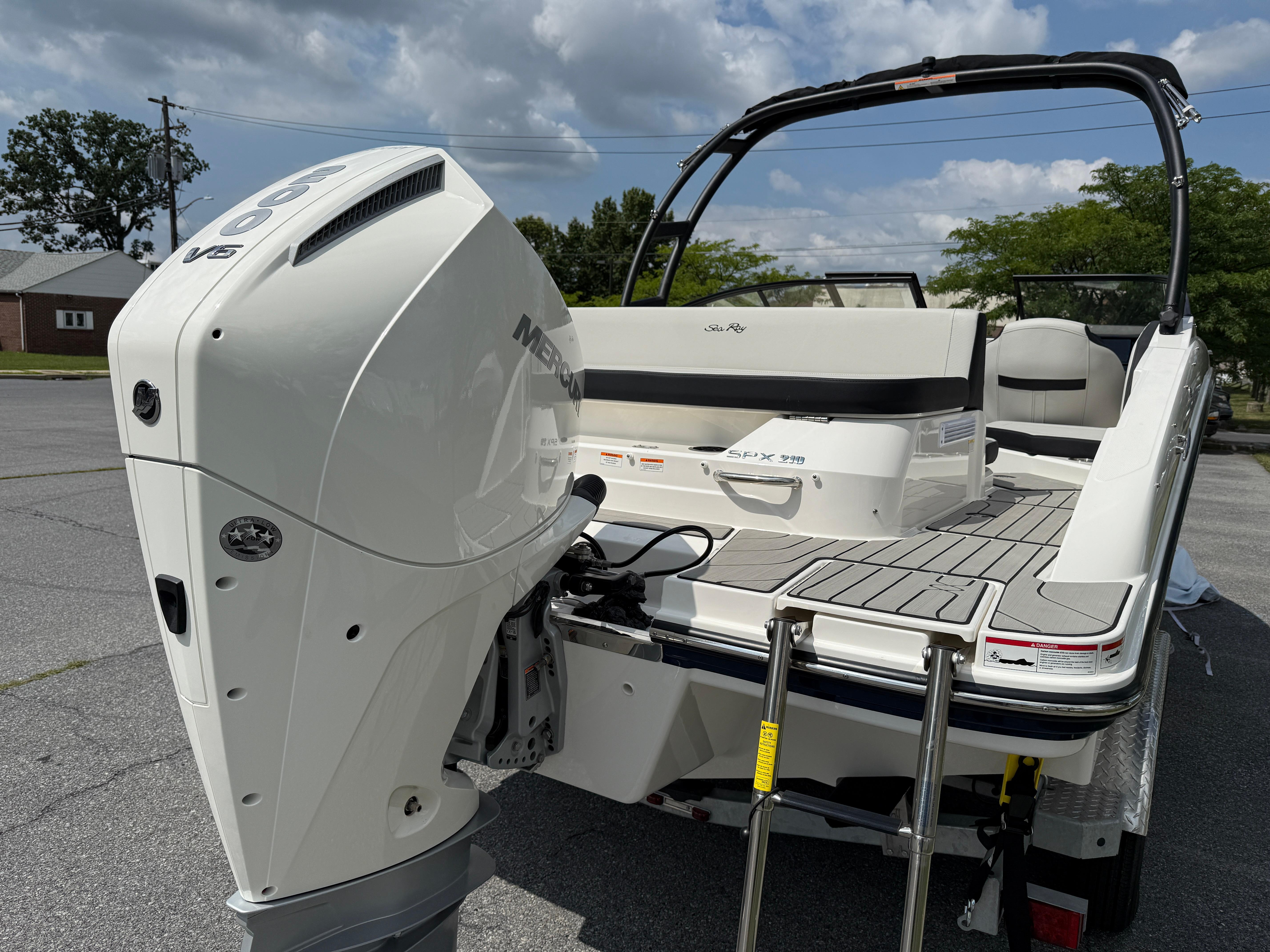 2026 Sea Ray SPX 210 Outboard boat with powerful Mercury engine, sleek design, and spacious deck.