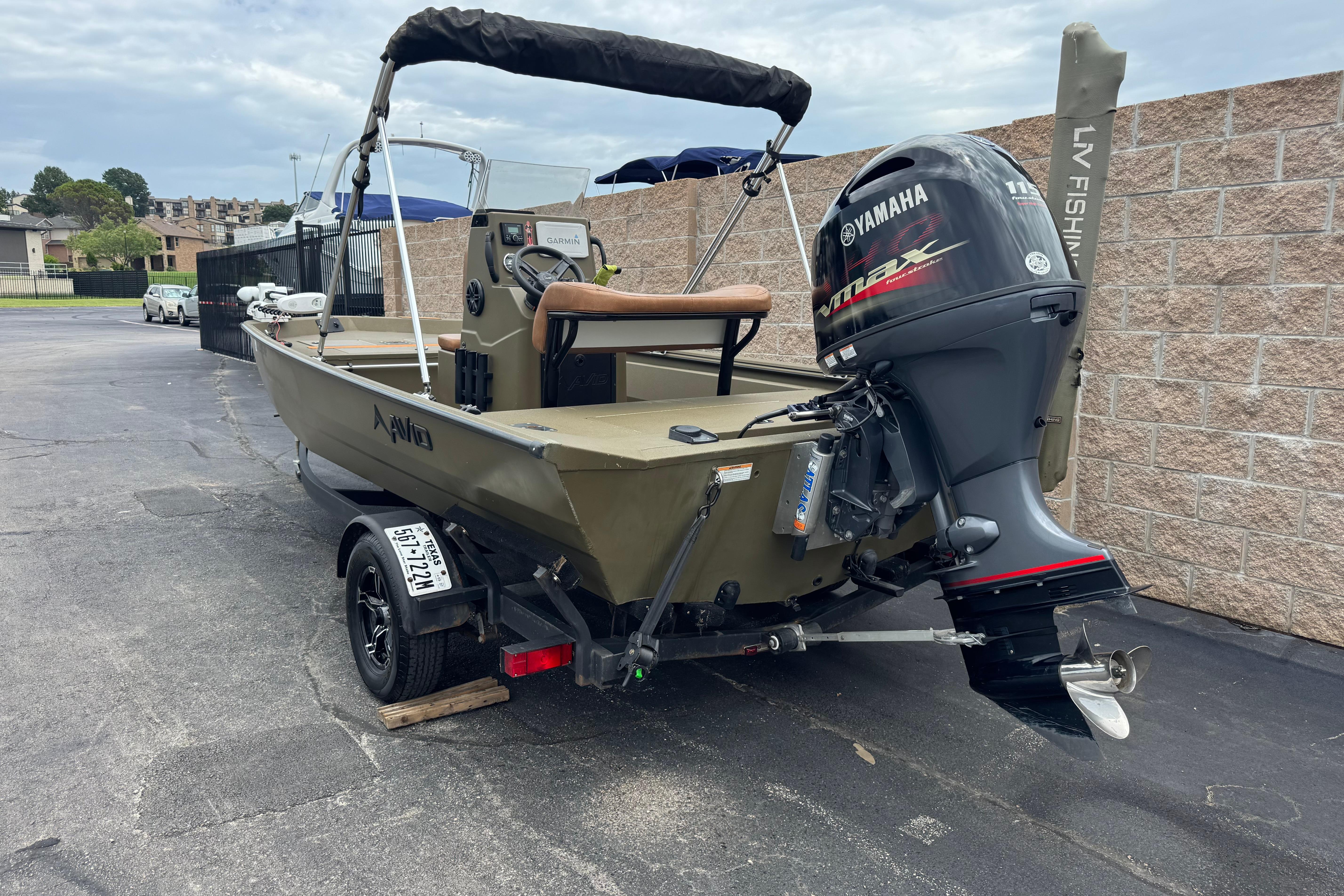 2023 Avid 18 Rogue CC boat with Yamaha outboard motor, parked on a trailer.