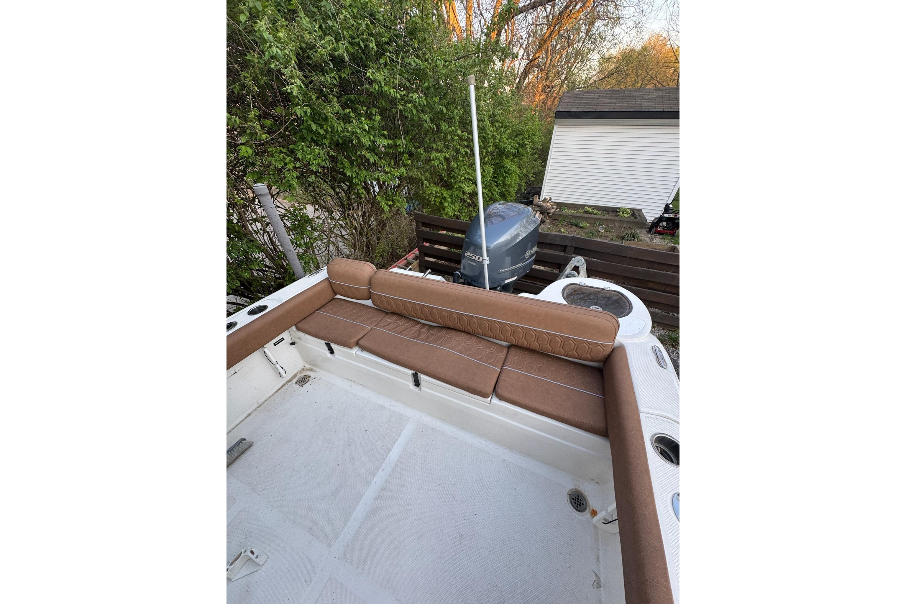 2013 Sea Fox 246 Commander boat with brown seating and Yamaha outboard motor.