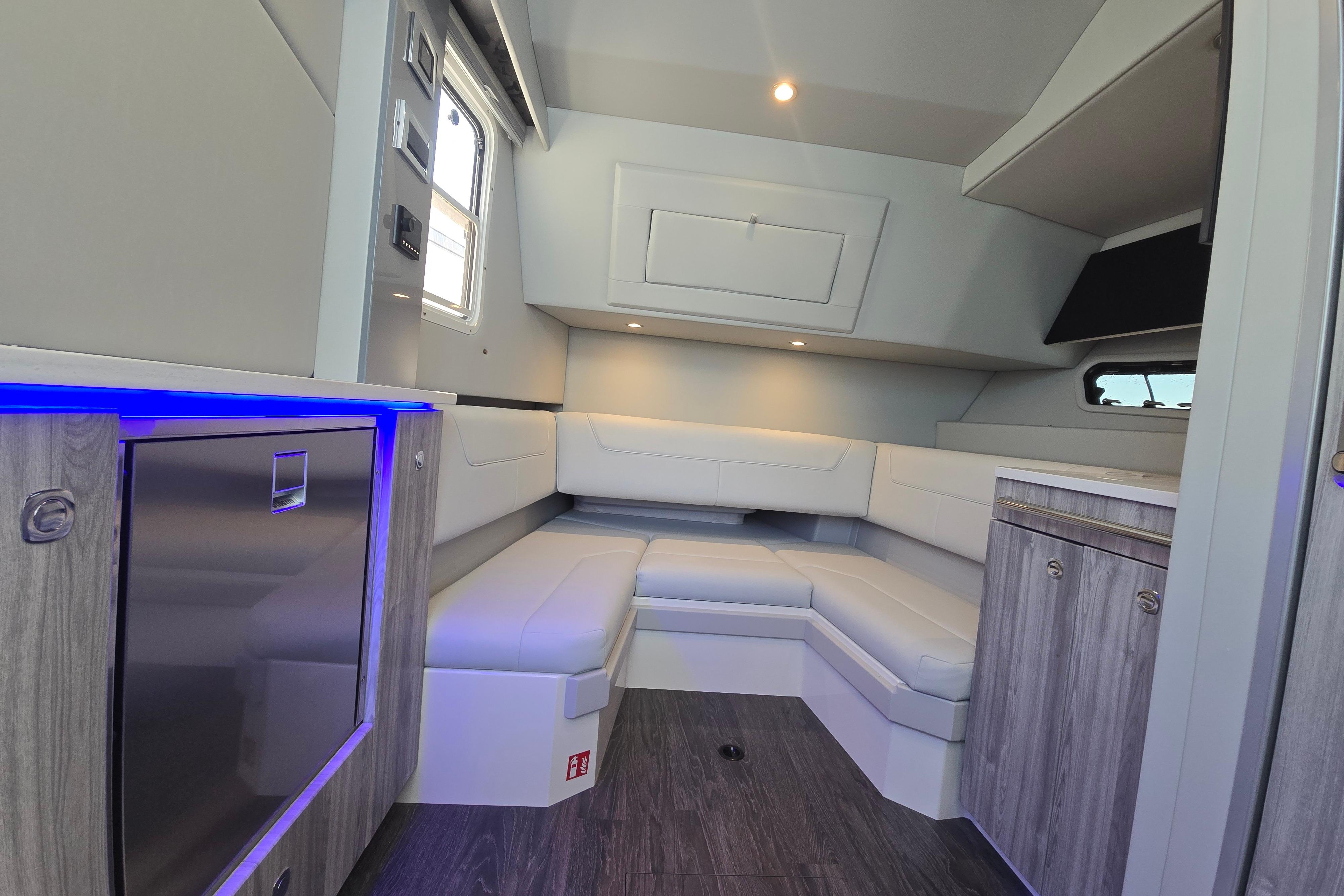 Interior of 2025 Formula 380 Super Sport Crossover OB, featuring modern seating and ambient lighting.