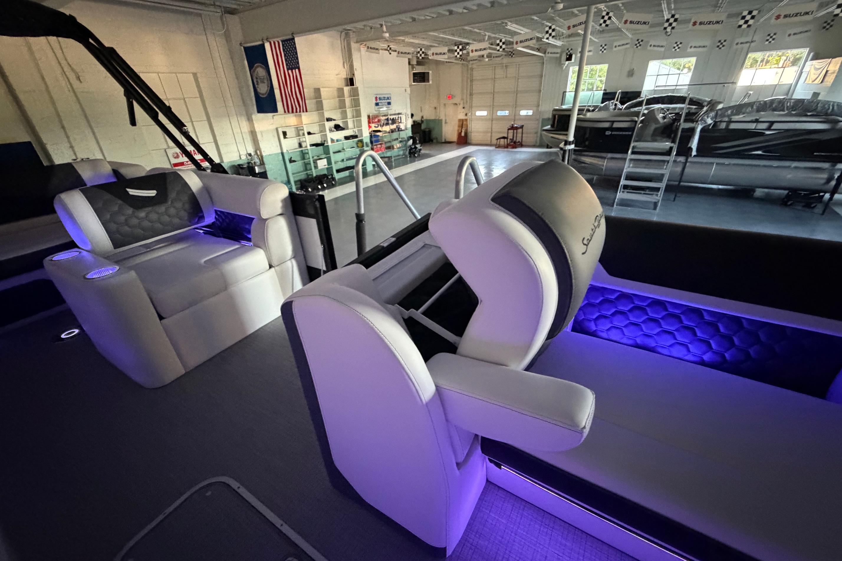 Luxurious interior of 2026 South Bay 525SB2 boat with ambient purple lighting.