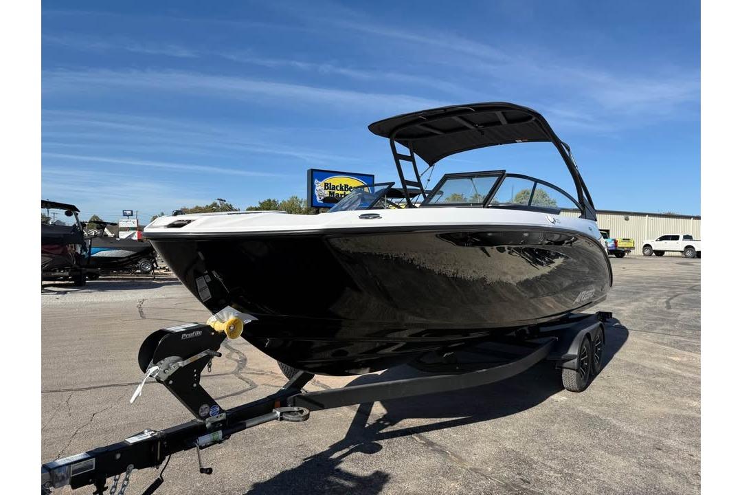2026 Yamaha Boats AR250 on trailer, sleek black design, parked outdoors under clear blue sky.