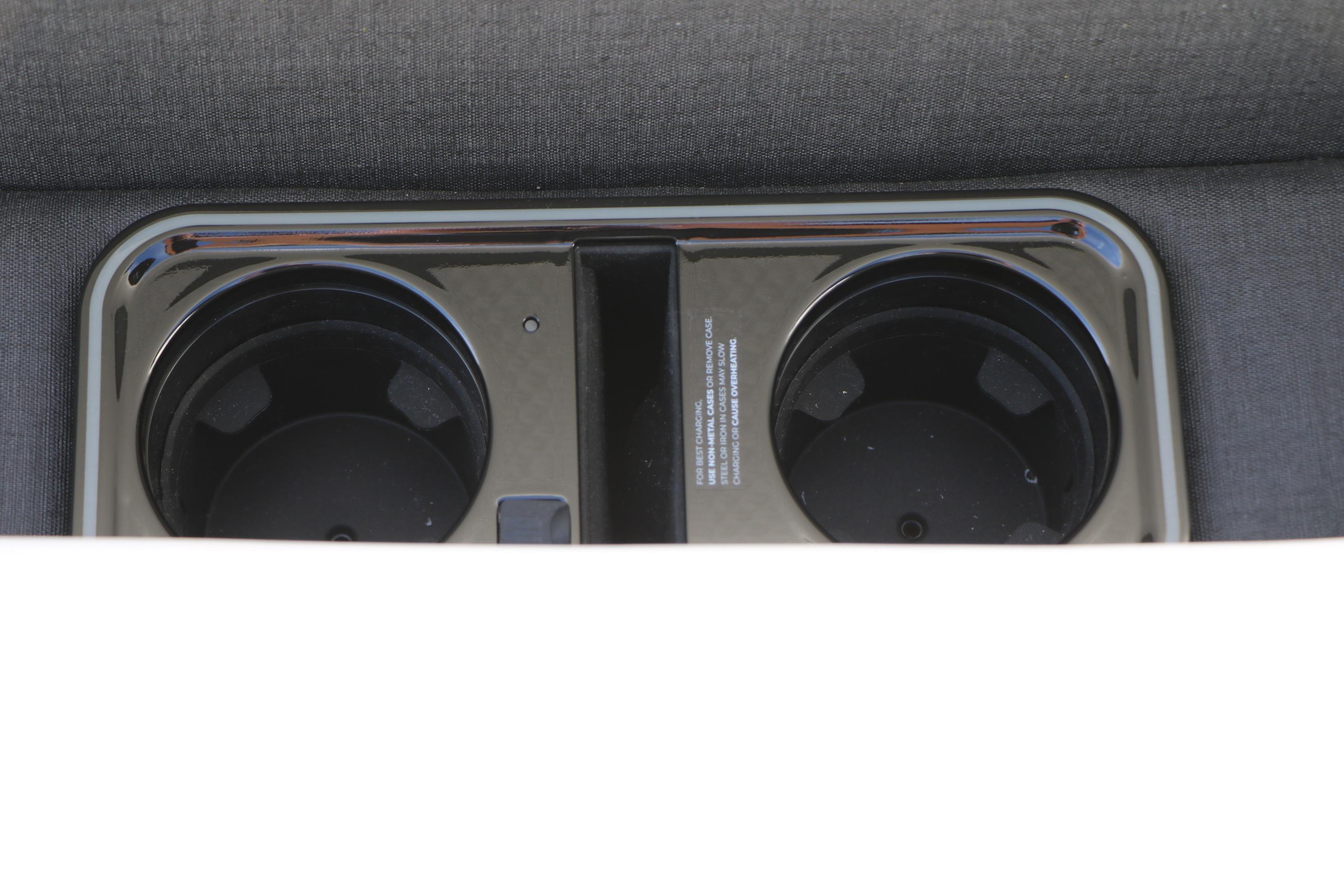 Cup holders in the 2026 Evotti 725 CS Tri-Toon boat's seating area.