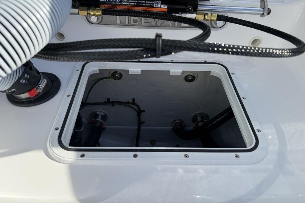 2026 Tidewater 198 CC Adventure boat interior compartment with visible wiring and components.