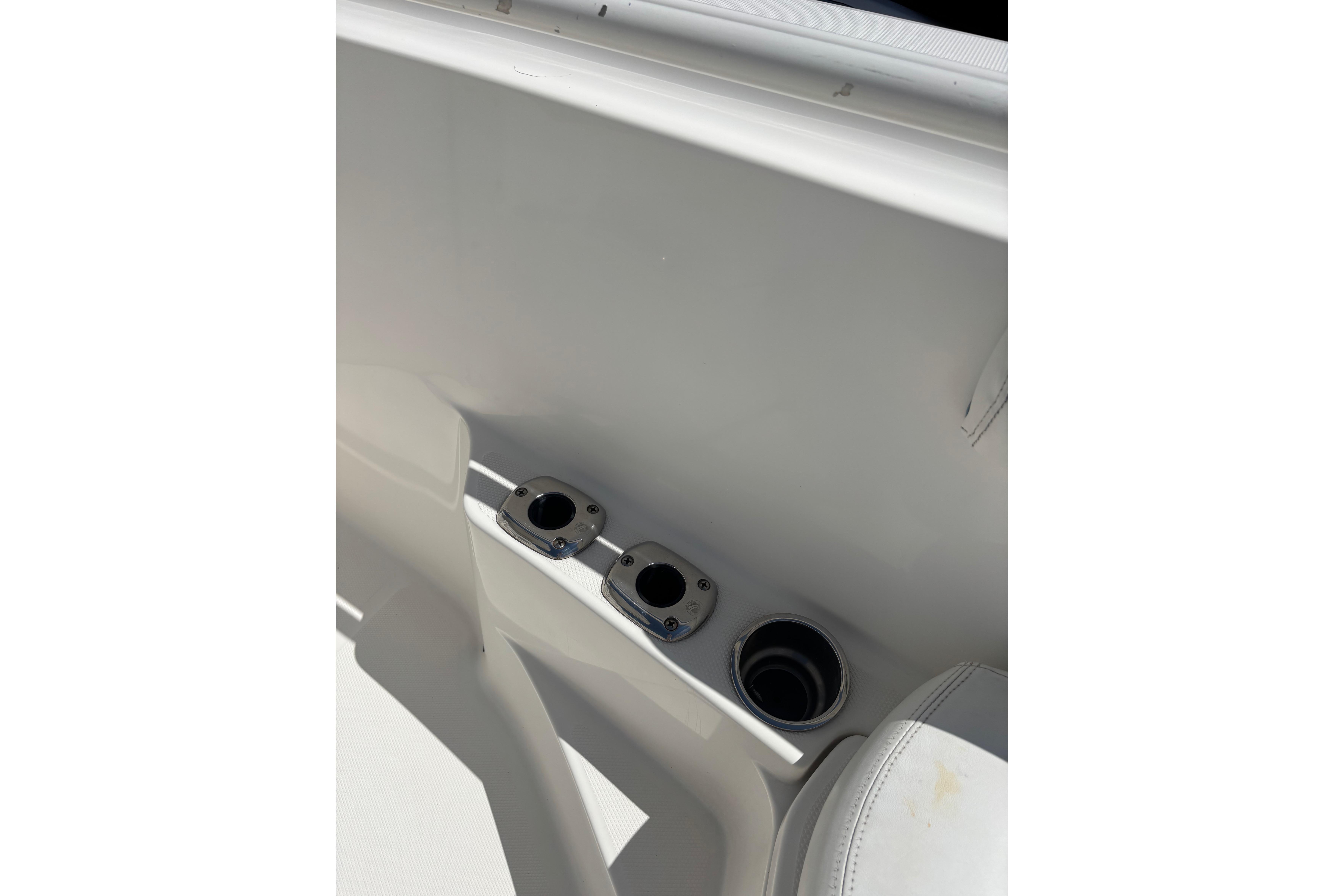 Cup holders on a 2006 Edgewater 318CC boat interior.