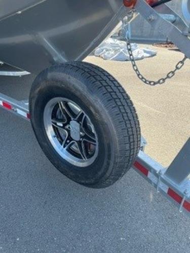 2025 Spartan 2600 Olympia trailer with spare tire mounted on the side.