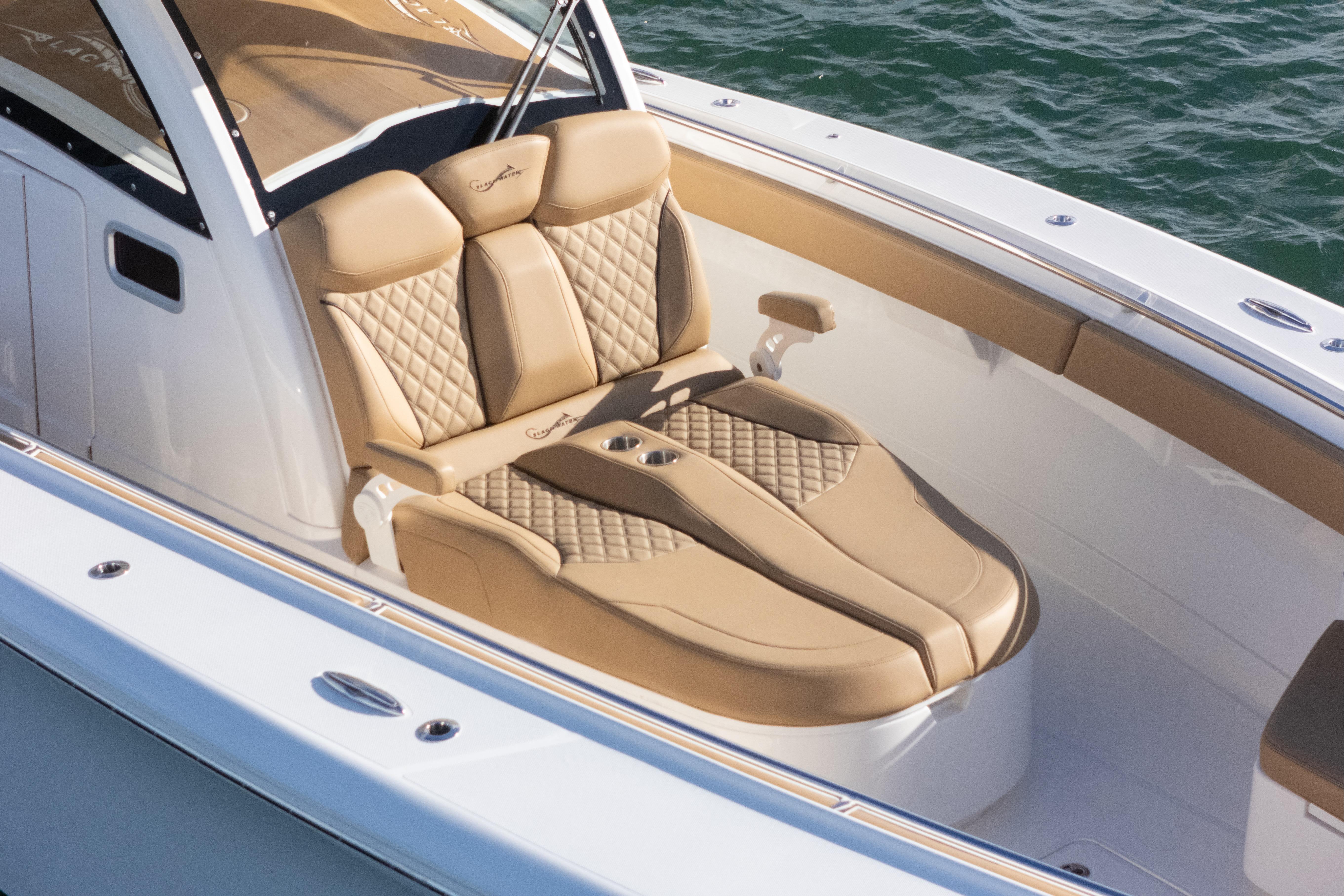 Luxurious seating on 2026 Blackwater 41 Performance Fish boat, featuring tan leather upholstery.