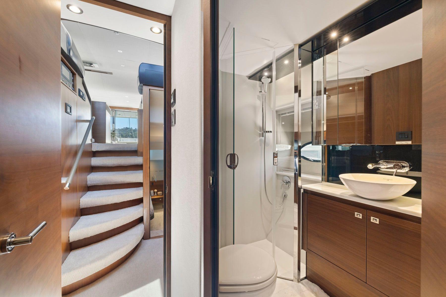 Luxurious bathroom and staircase in 2015 Princess 60 Flybridge Motor Yacht.
