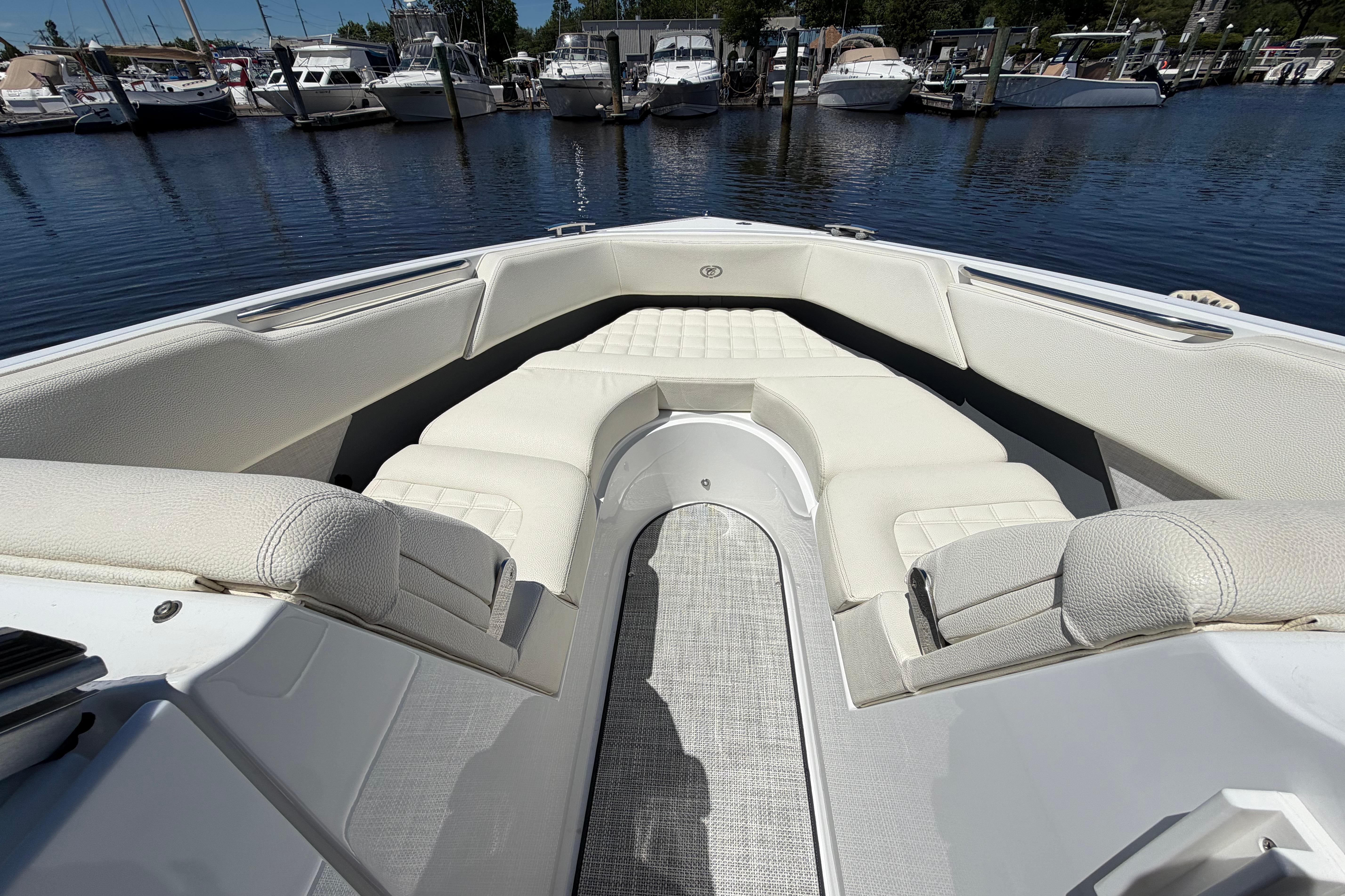 Luxurious seating area on a 2020 Cobalt R3 boat, docked at a marina.