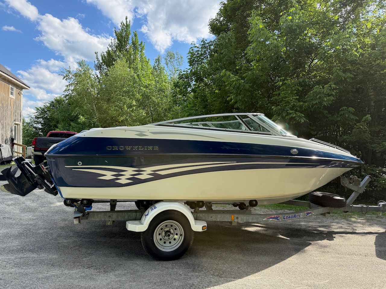 2000 Crownline 192 BR boat on trailer outdoors.