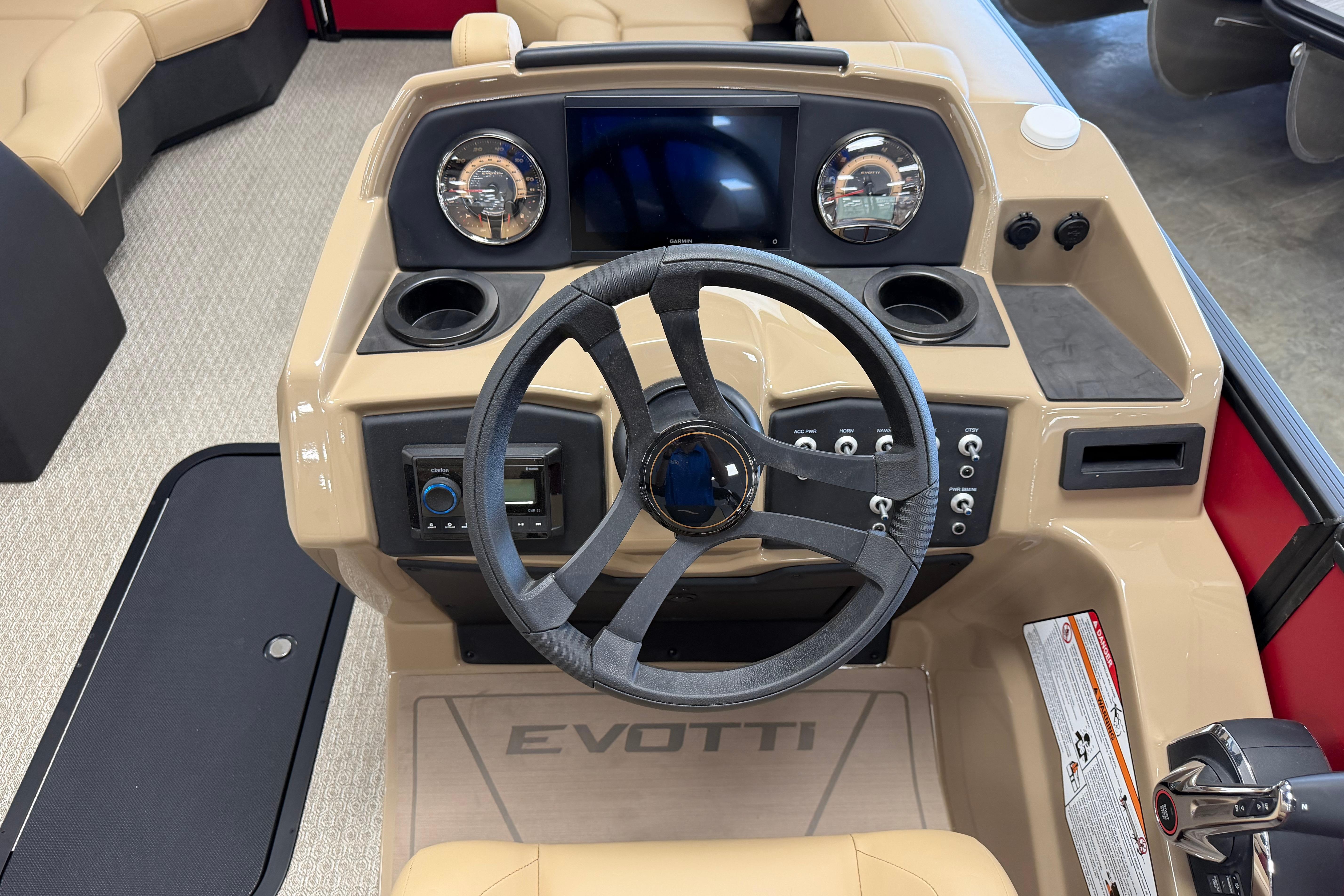 2026 Evotti 523CS boat dashboard with steering wheel and control panel.