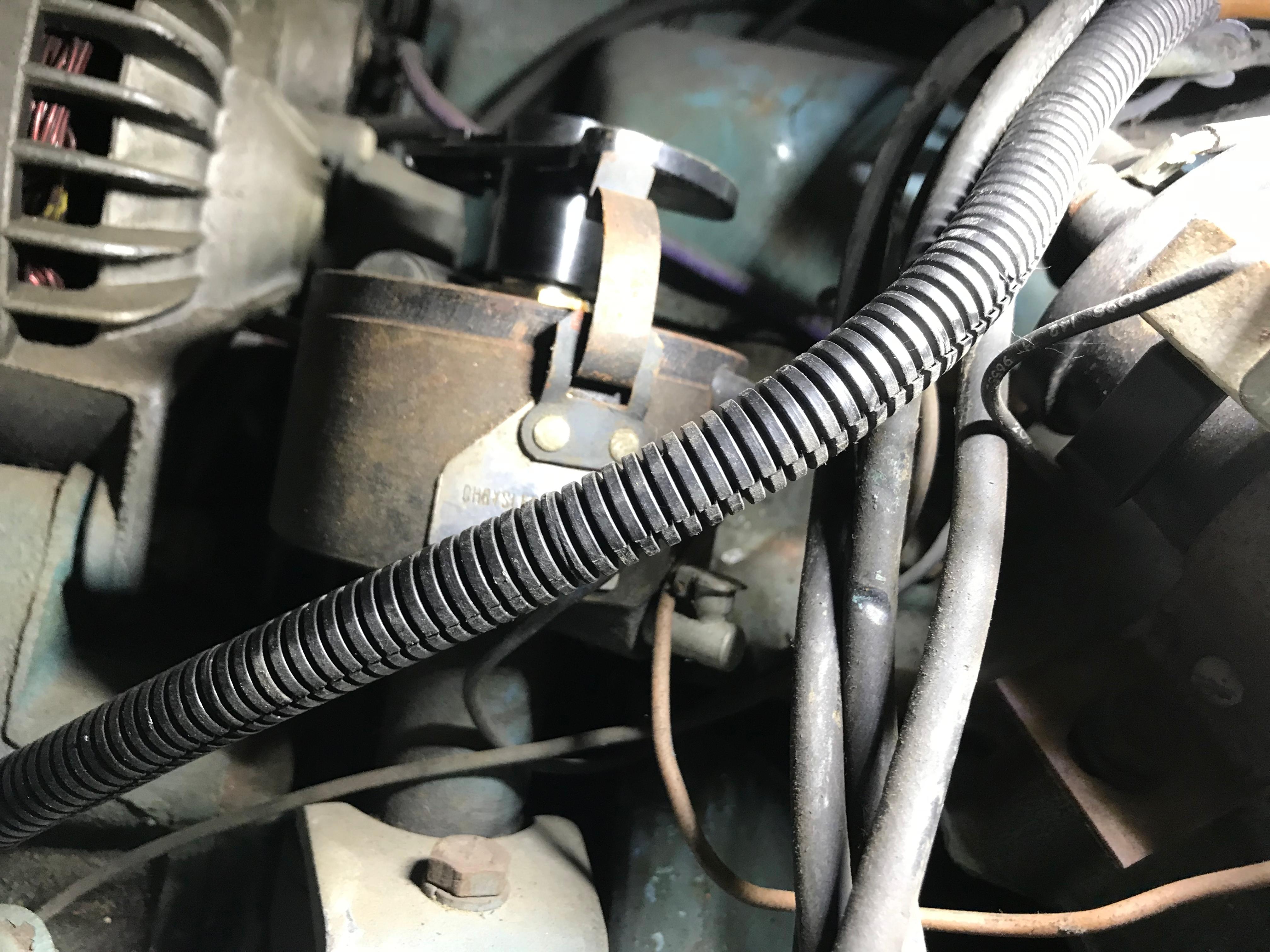 Close-up of a 2002 Classic Jesperson/Zimmer engine component with visible wiring and metal parts.
