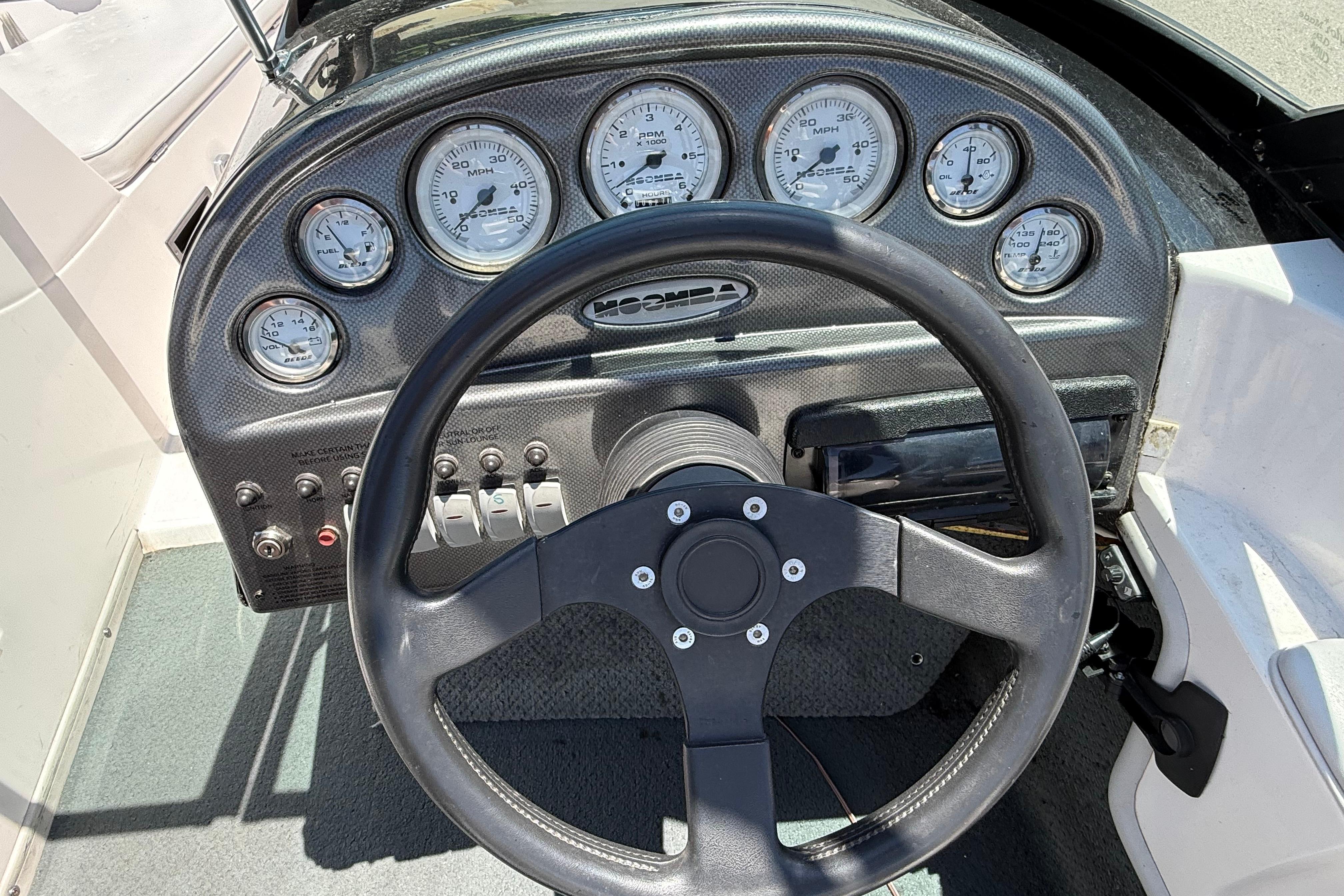 2001 Moomba Outback dashboard with steering wheel and gauges.