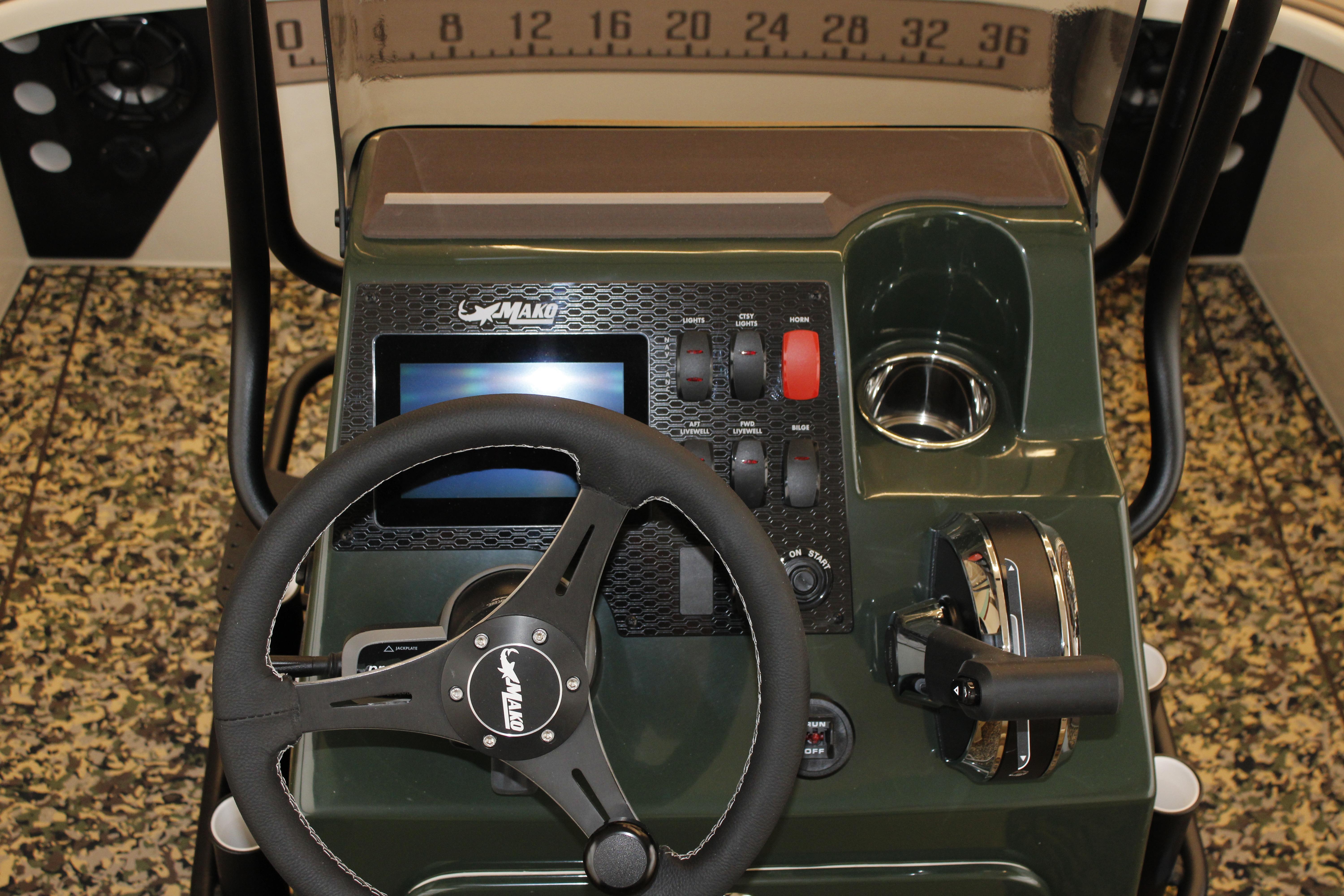 Steering console of 2026 Mako 18 Pro Skiff Backwater Edition with controls and display.