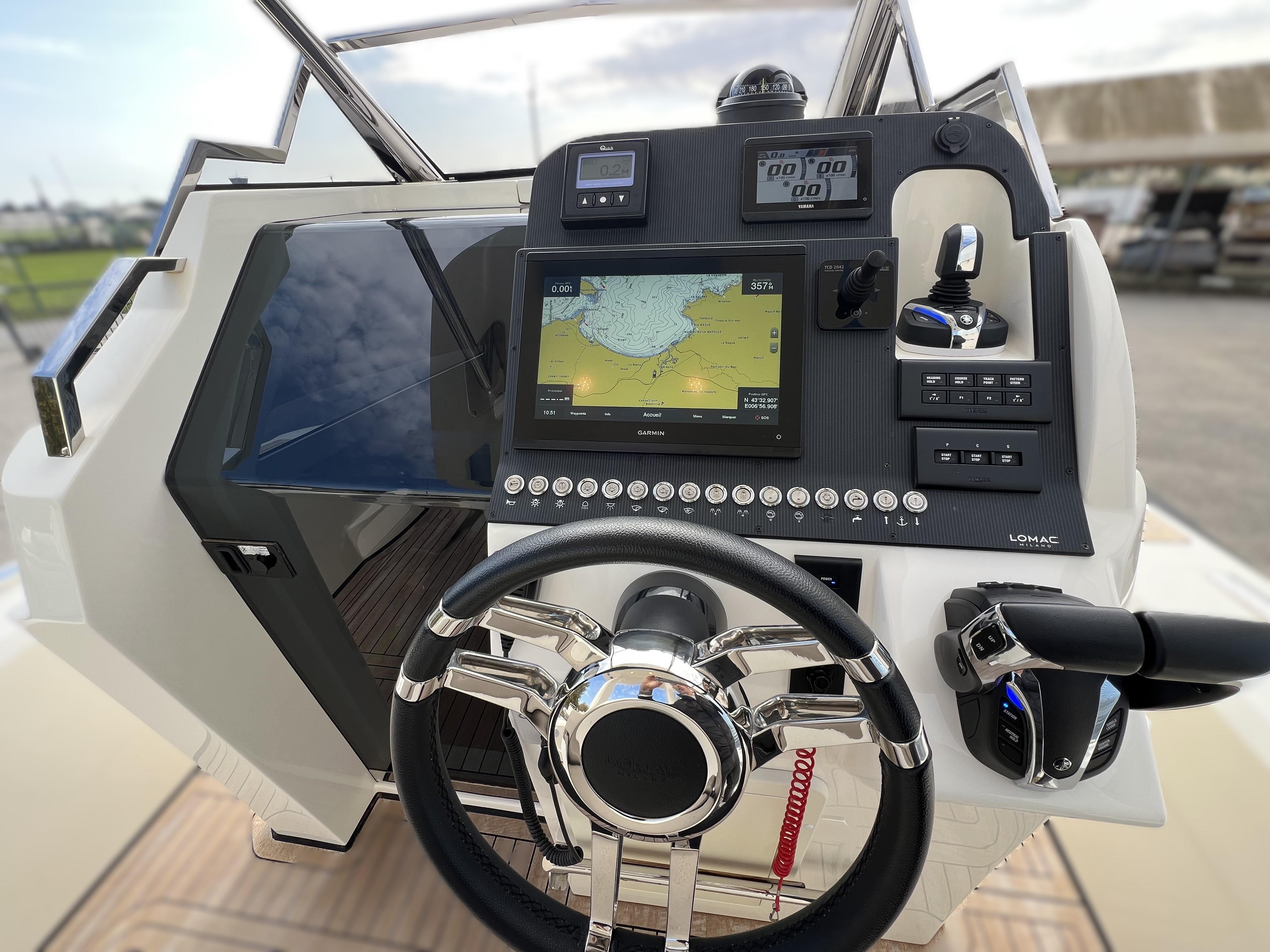2023 Lomac GranTurismo 12.0 dashboard with navigation system and steering wheel.