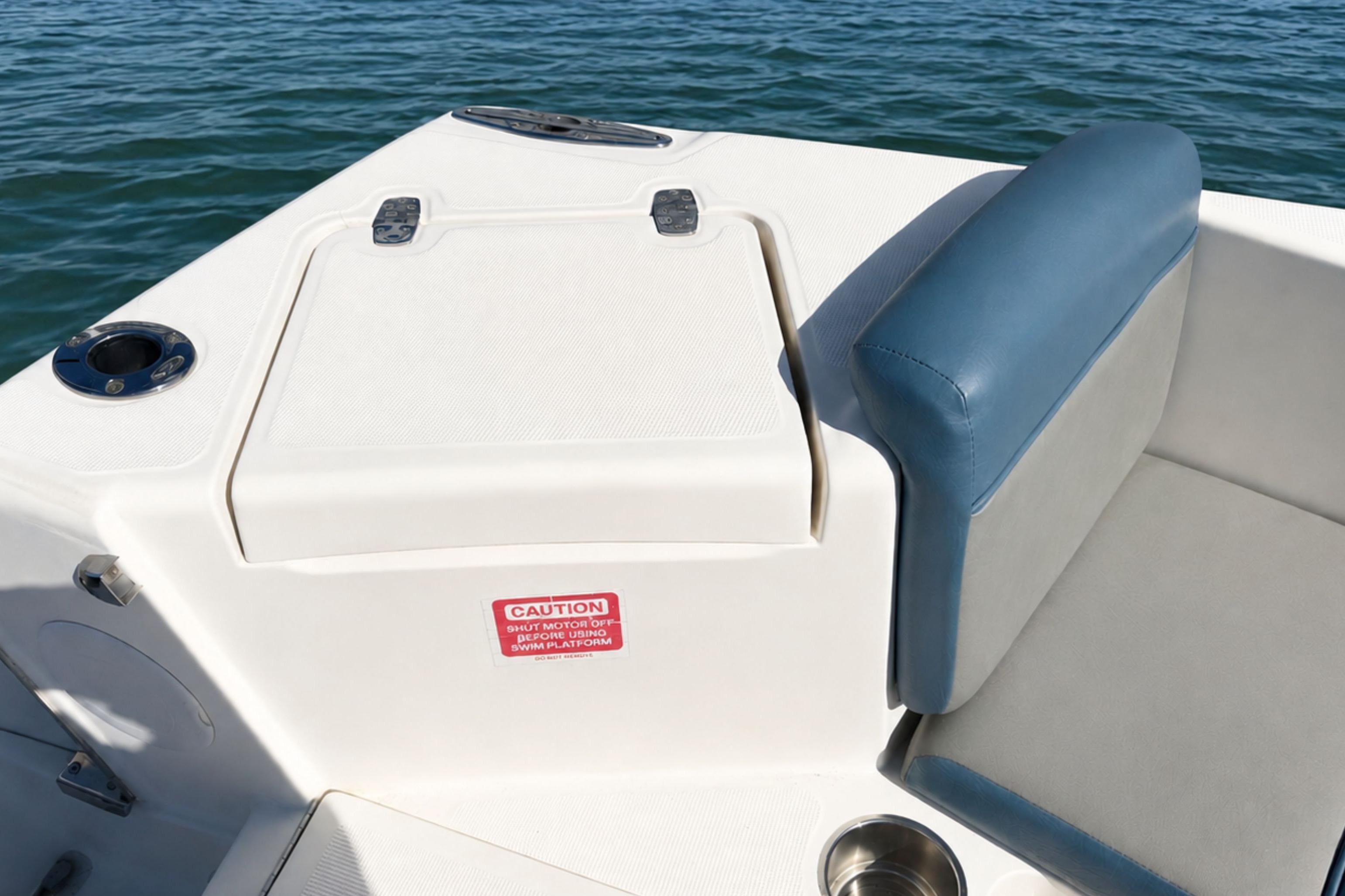 2008 Scout 222 Abaco boat interior with cushioned seating and storage compartment.