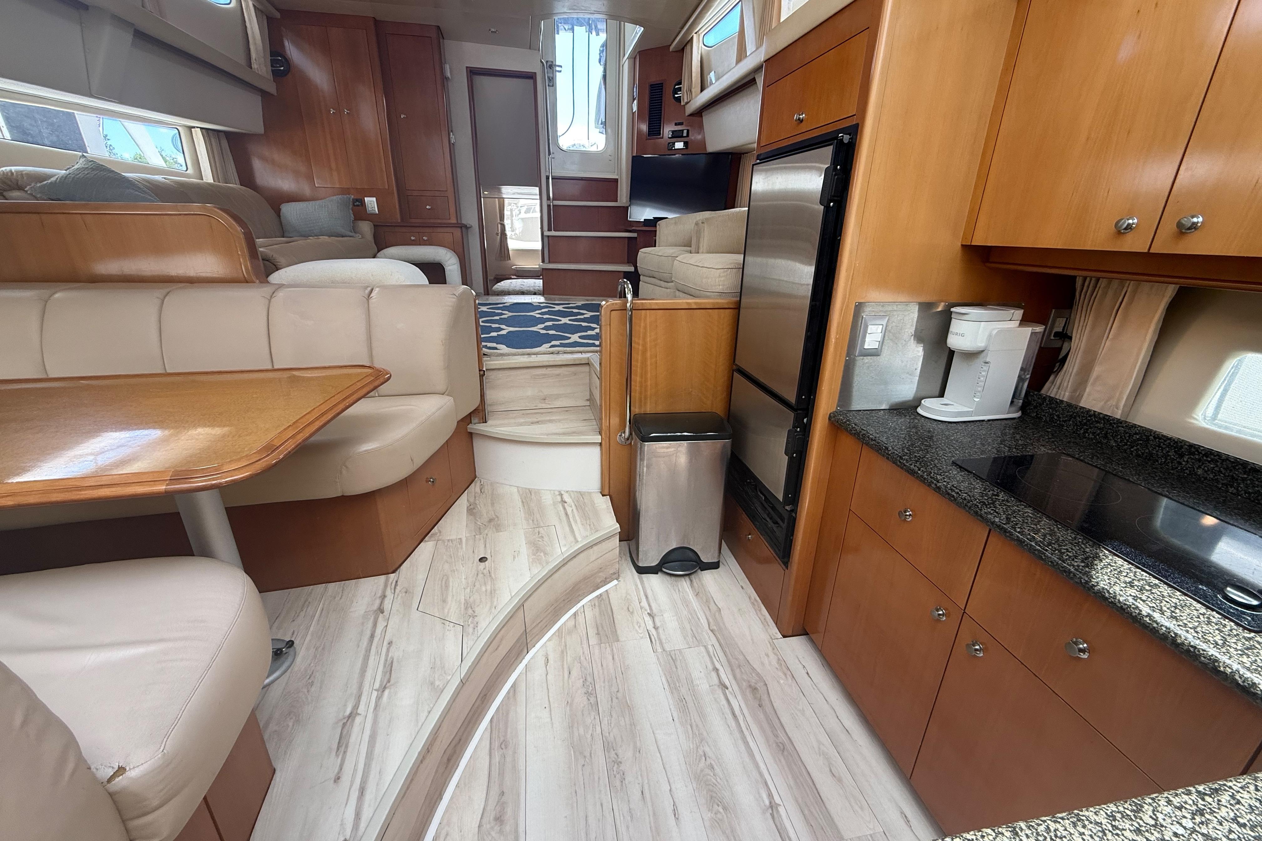Interior of 2006 Carver 43 Motor Yacht with modern kitchen and cozy seating area.