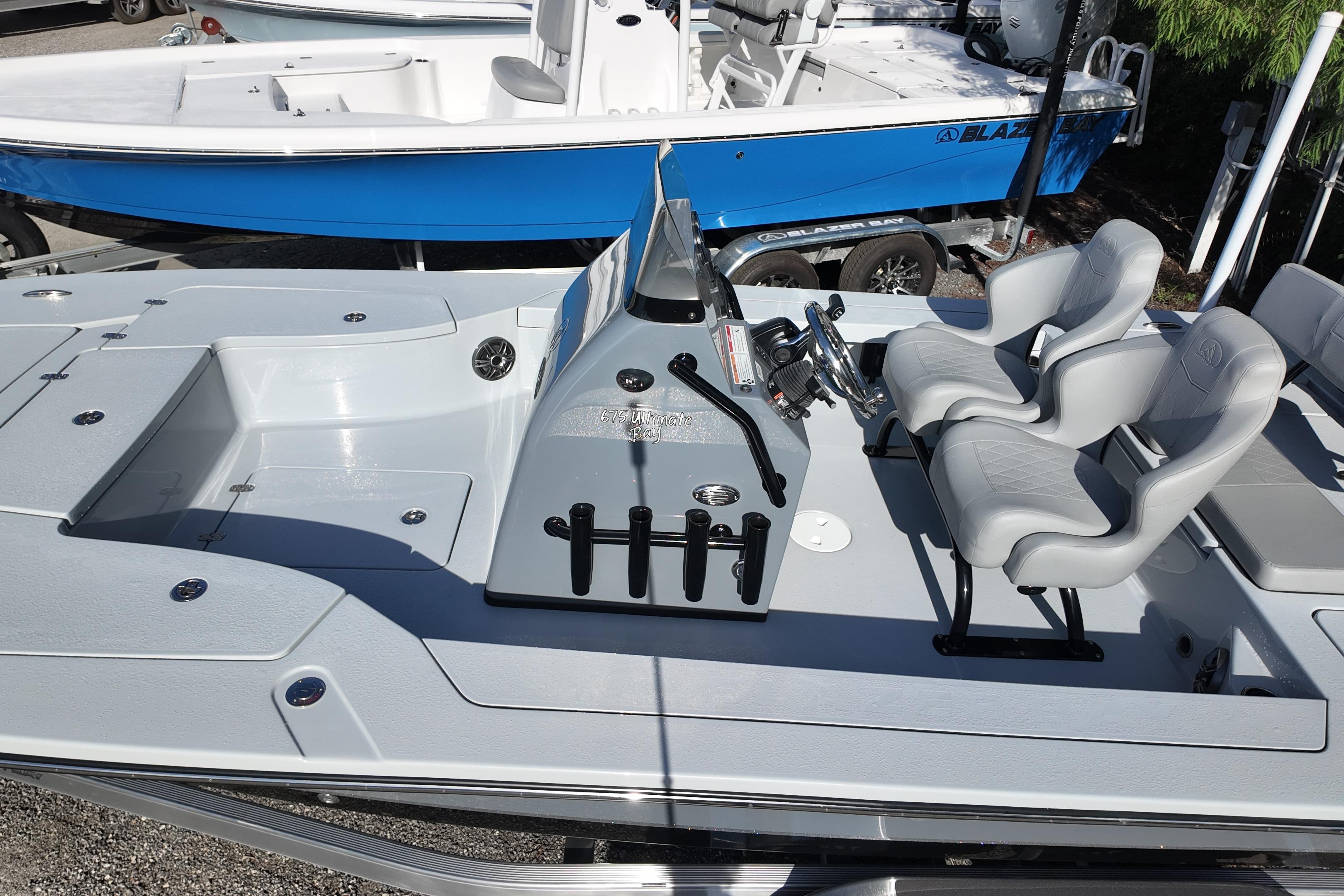 2026 Blazer Bay 675 Ultimate Bay boat interior with dual seats and control console.