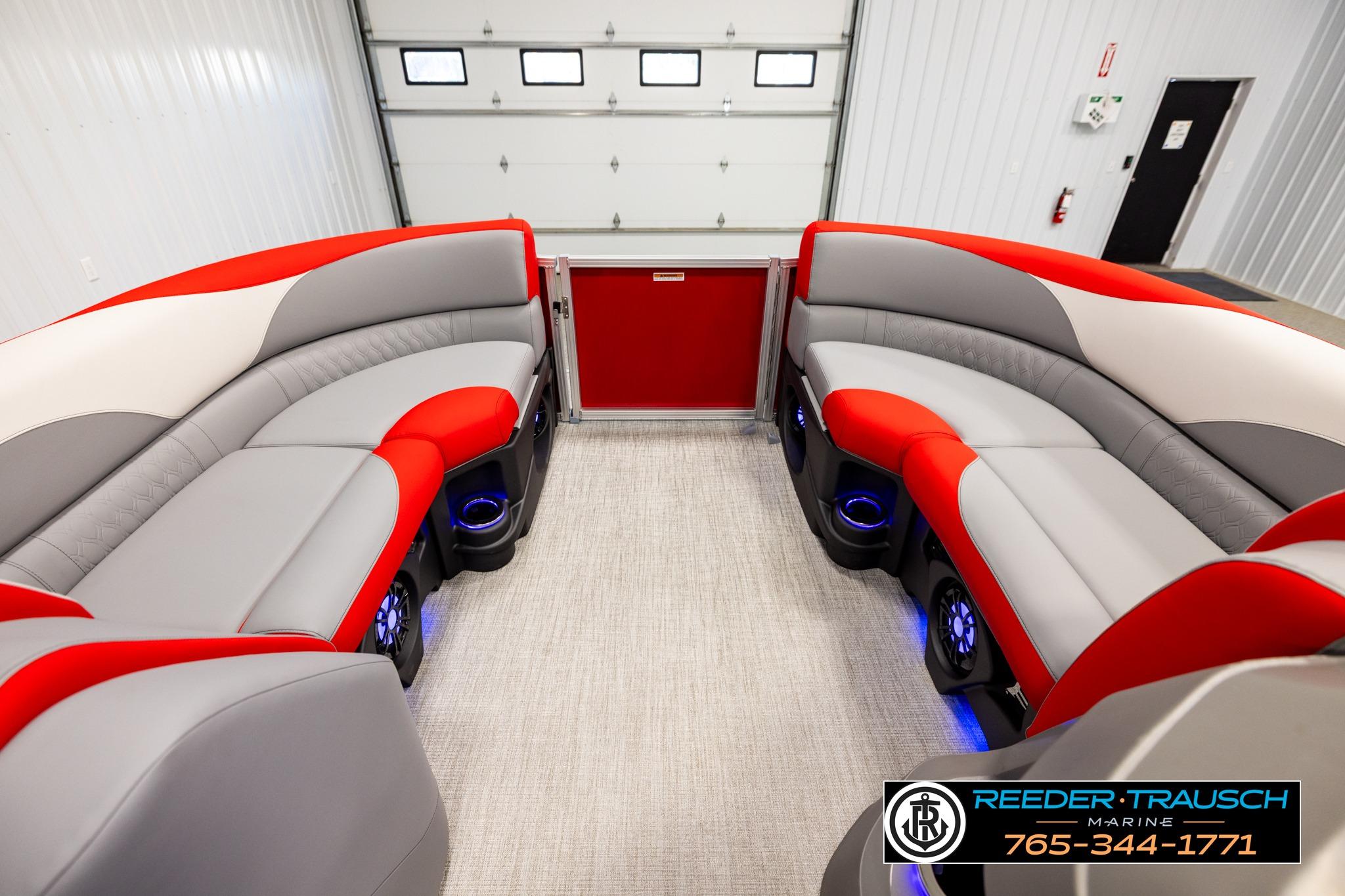 2026 Avalon LSZ QL pontoon boat interior with red and gray seating, blue LED lighting.