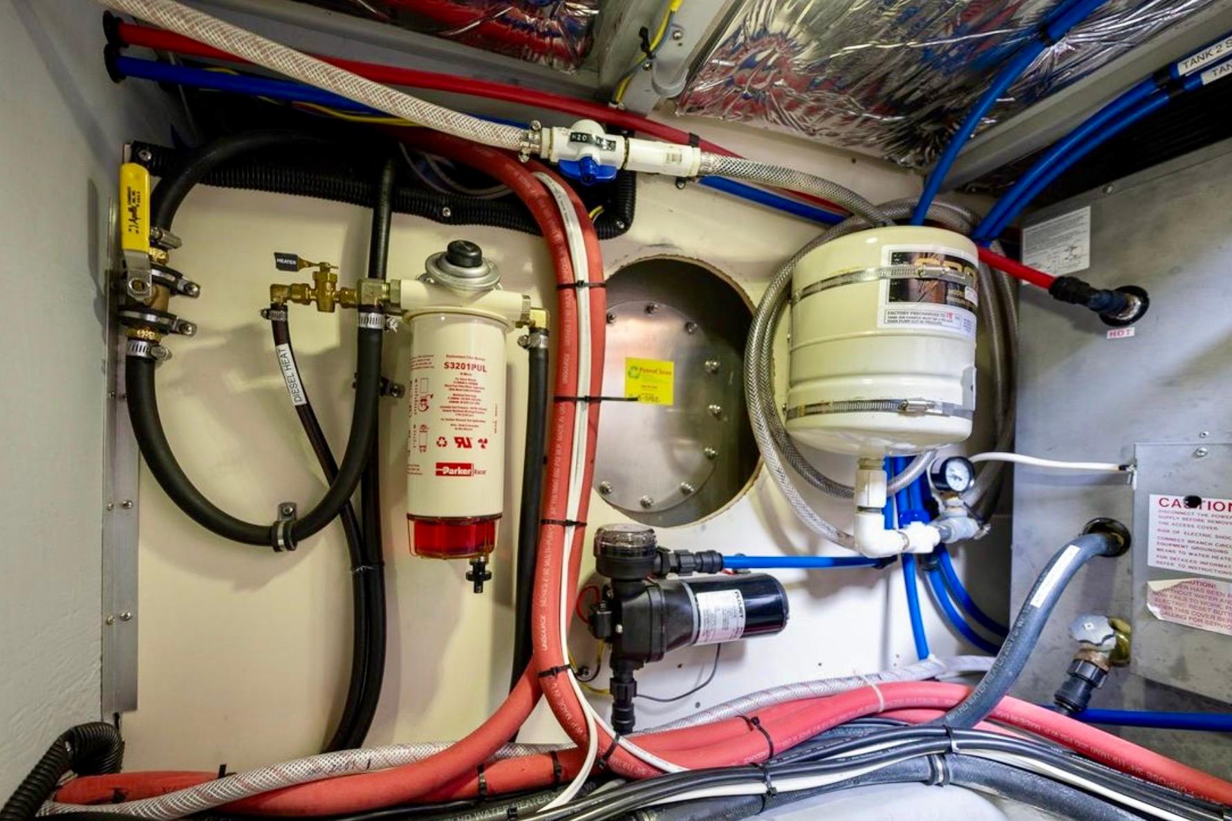 Engine room of 2004 Meridian 490 Pilothouse with fuel and water systems.
