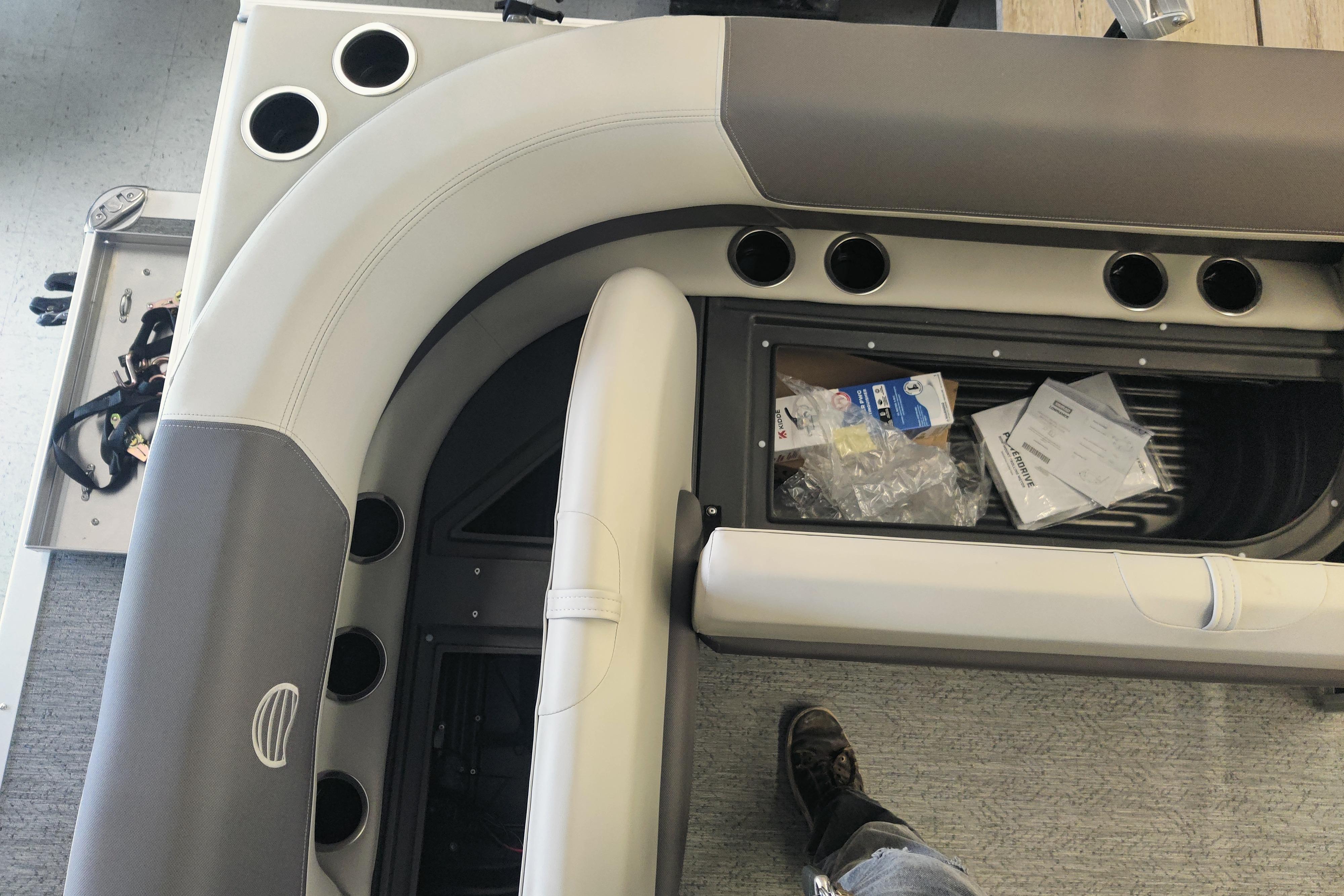 Interior view of 2026 Sun Tracker Bass Buggy 16 XL Select pontoon boat seating and storage.