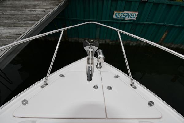 Bow of 2021 Regal 35 Sport Coupe at reserved dock space.