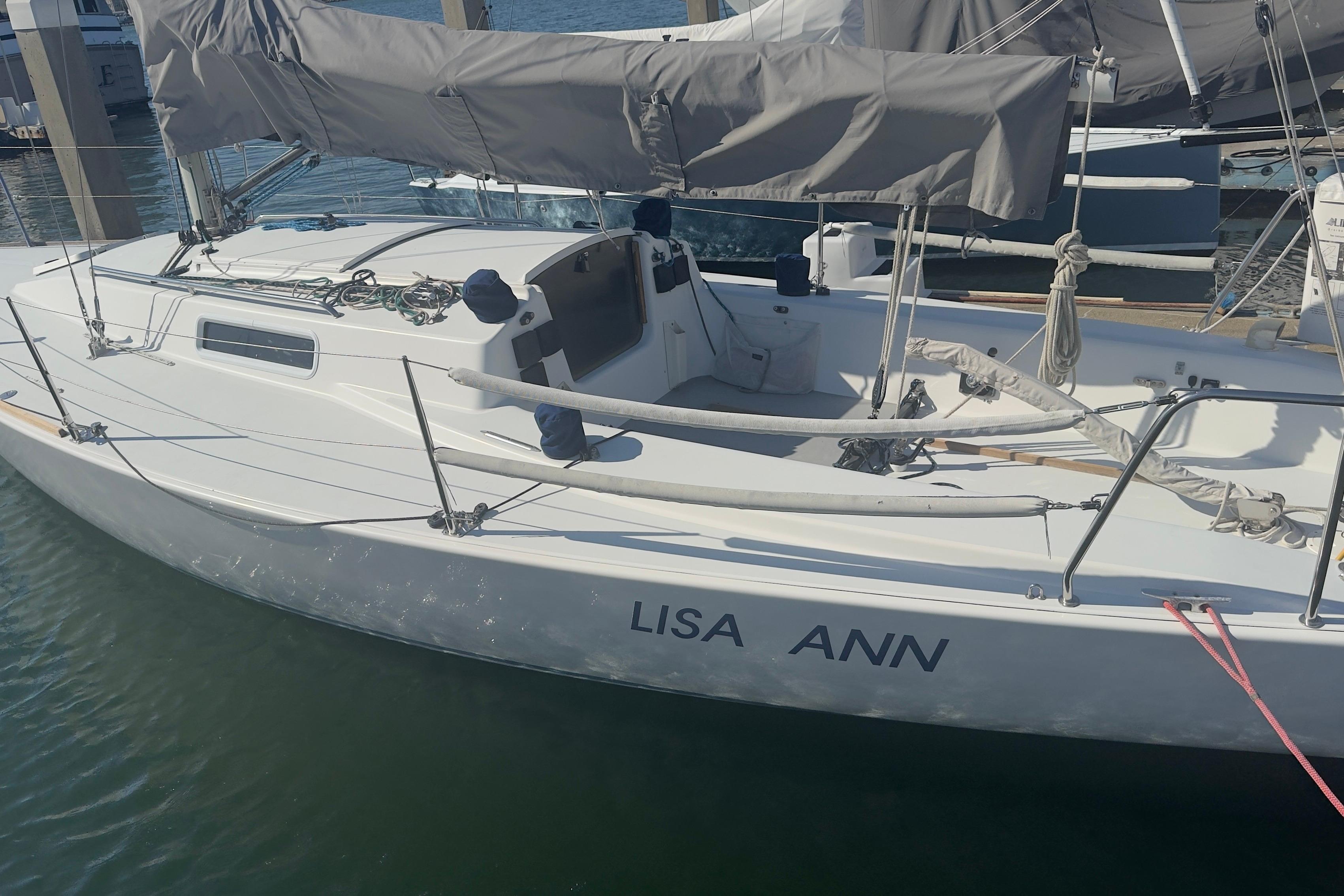 1994 J Boats J/92 sailboat named "Lisa Ann" docked at a marina.