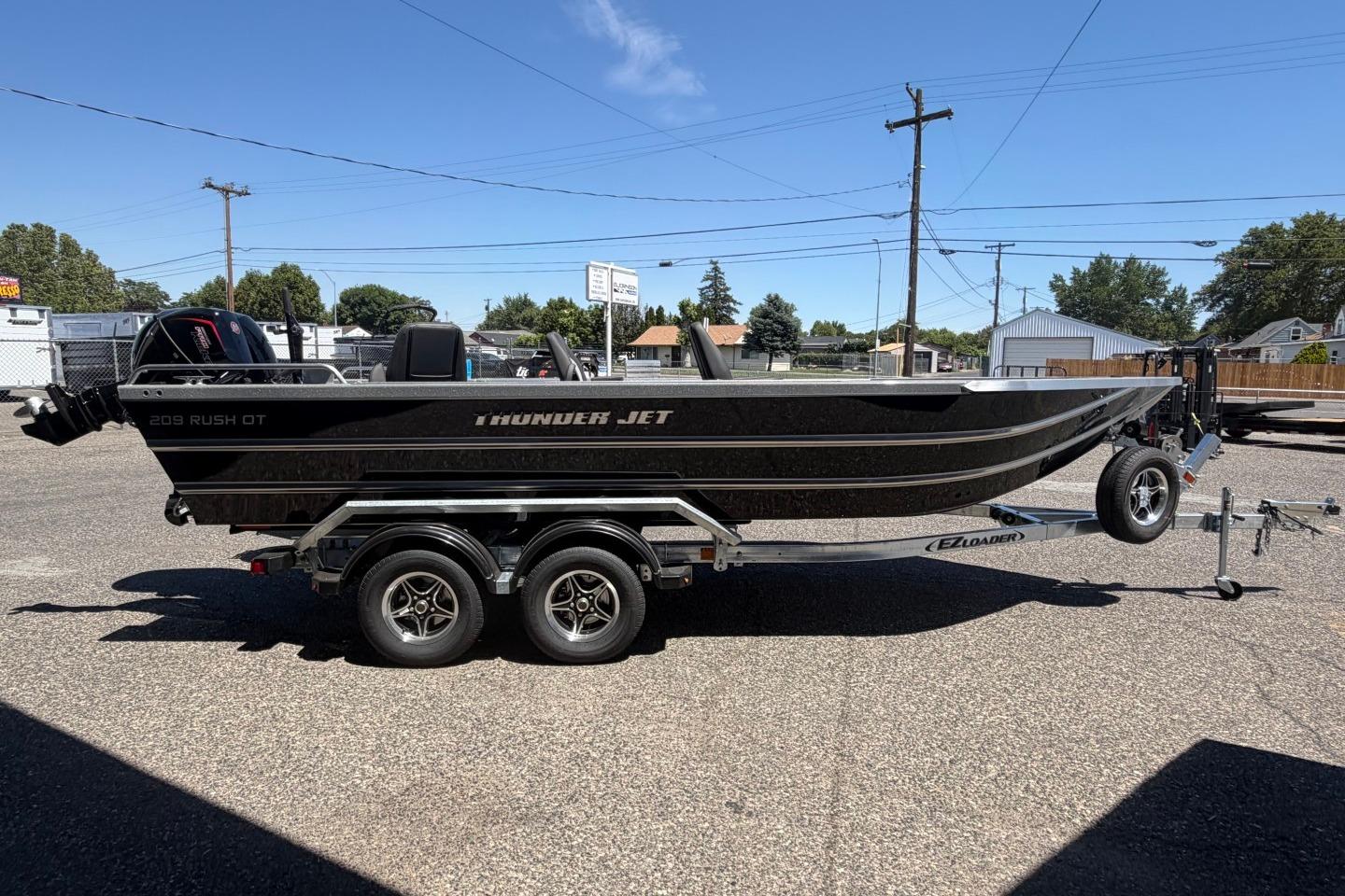 2026 Thunder Jet 209 Rush OT boat on trailer in outdoor setting.