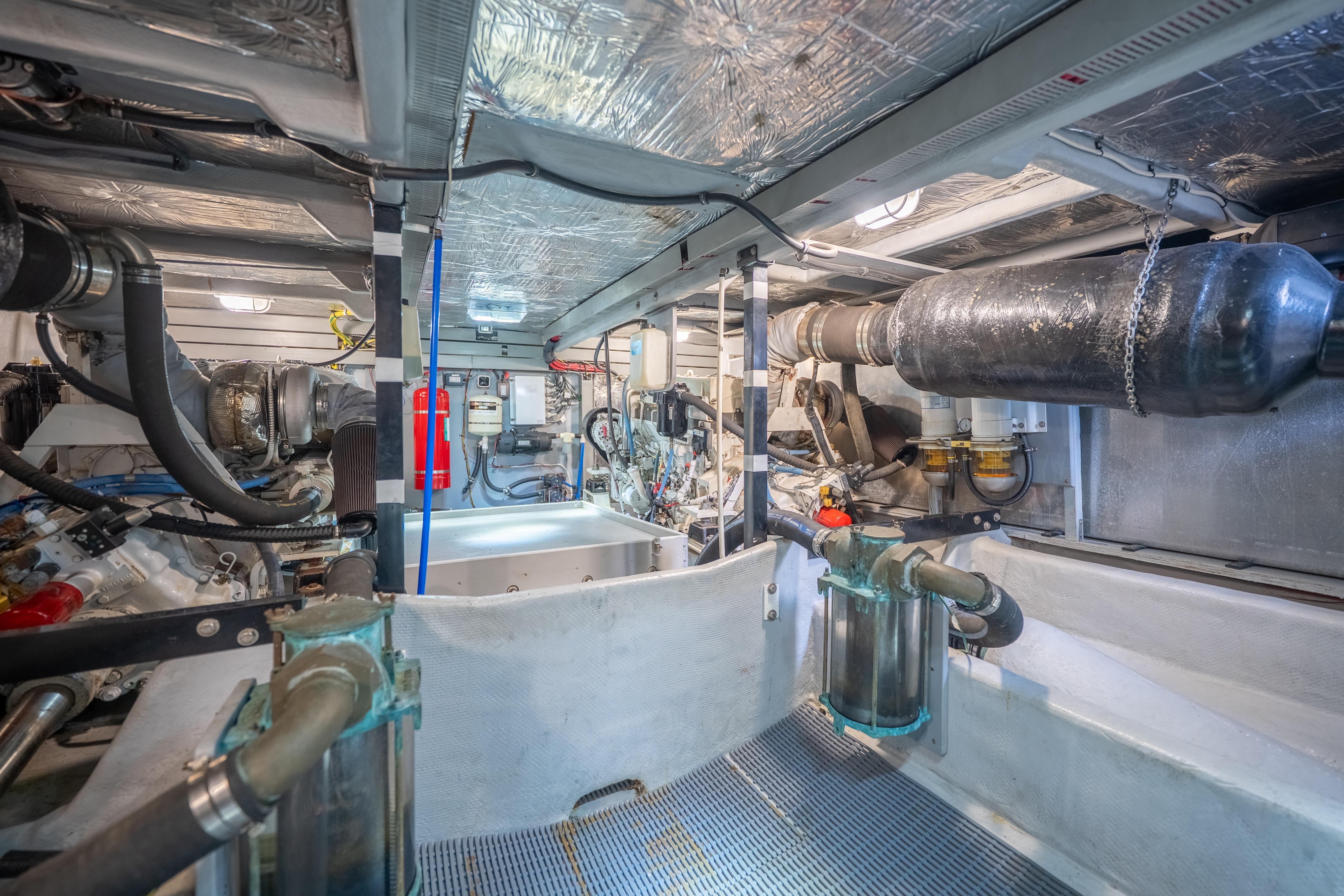Engine room of a 2007 Meridian 580 Pilothouse yacht, showcasing mechanical components.