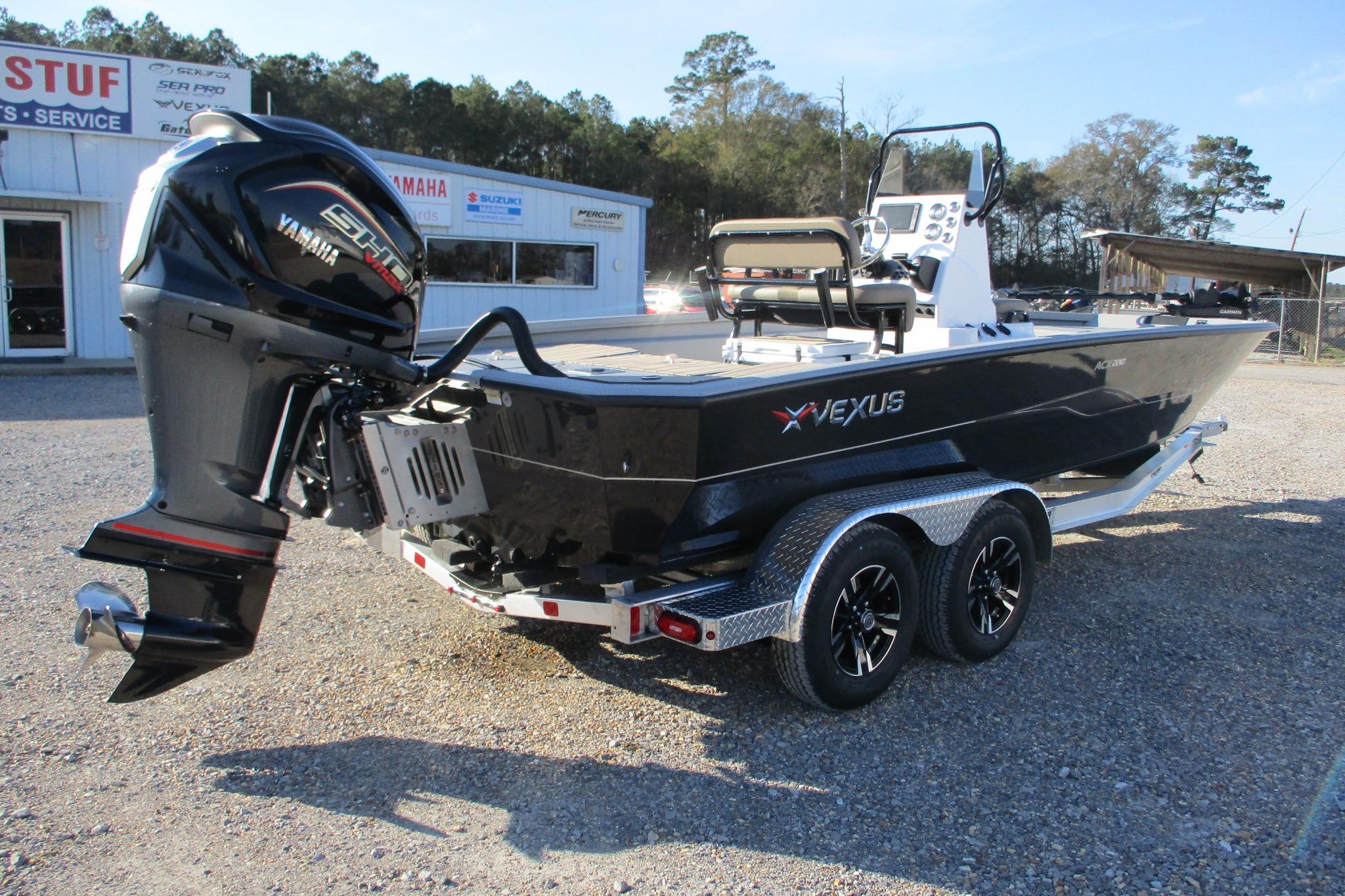 2026 Vexus ACX2210 boat with Yamaha engine on a trailer, parked outdoors.