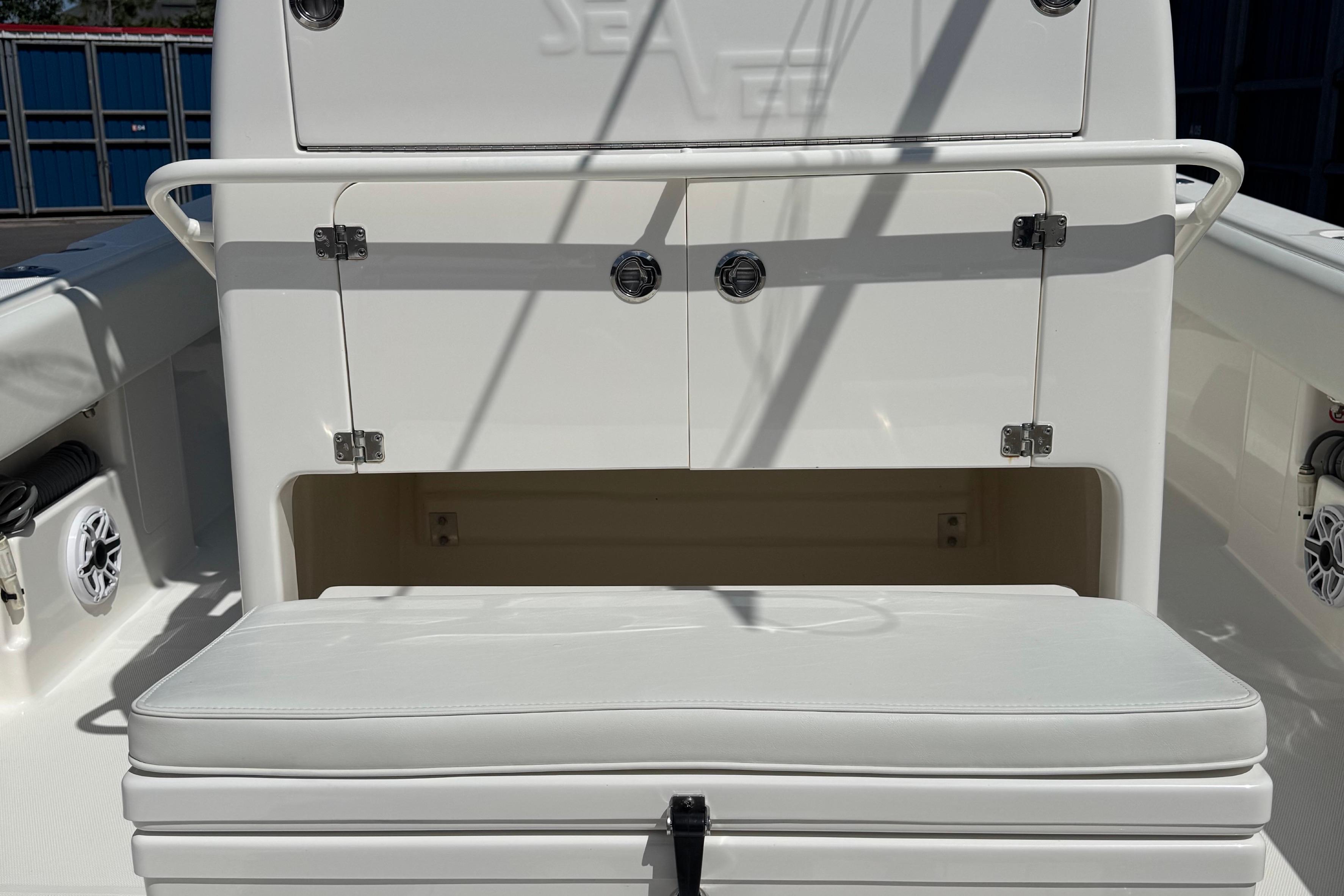 2024 SeaVee 32Z boat interior with cushioned seating and storage compartments.