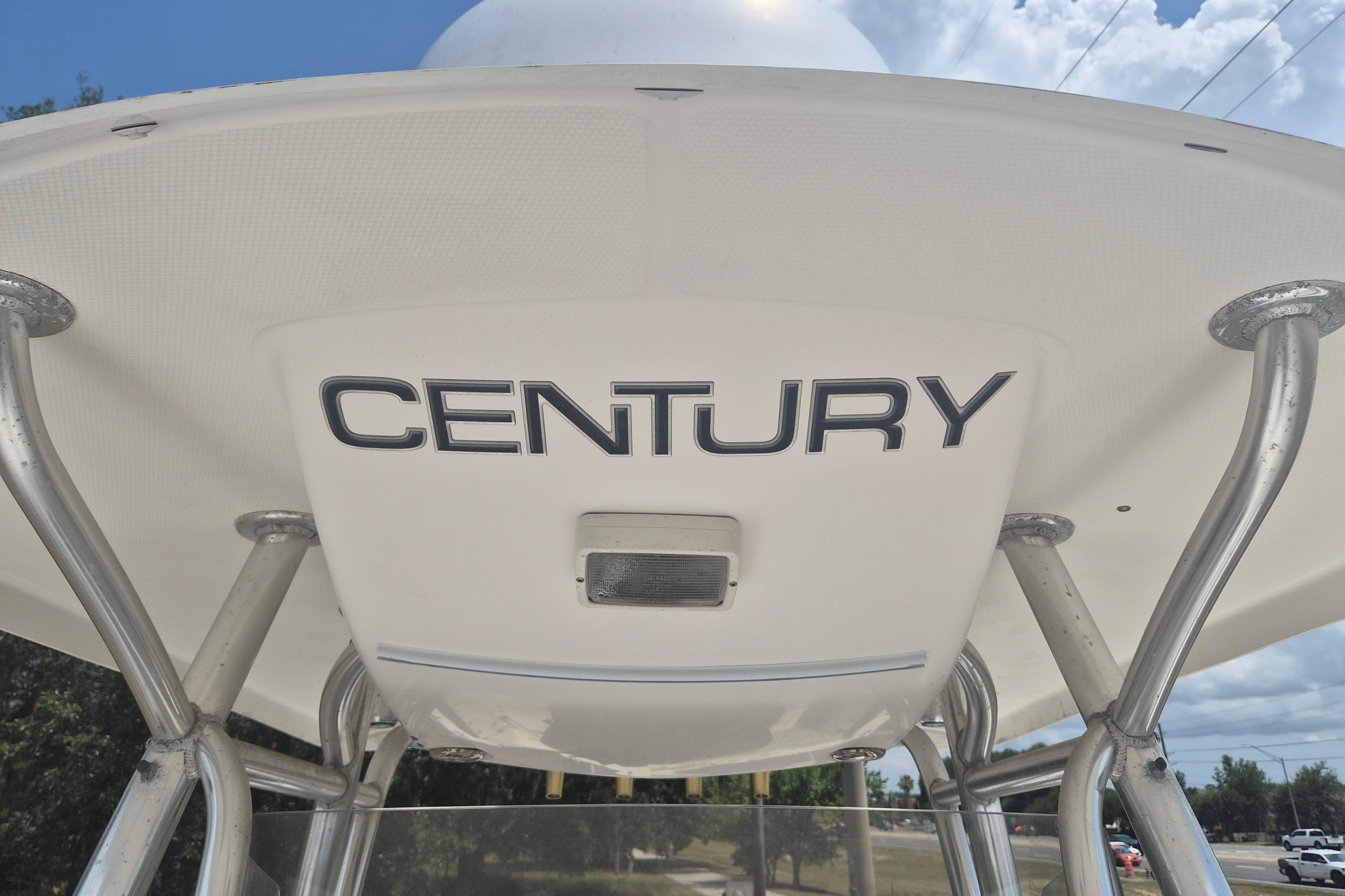 2006 Century 2900 Center Console boat with T-top and logo.