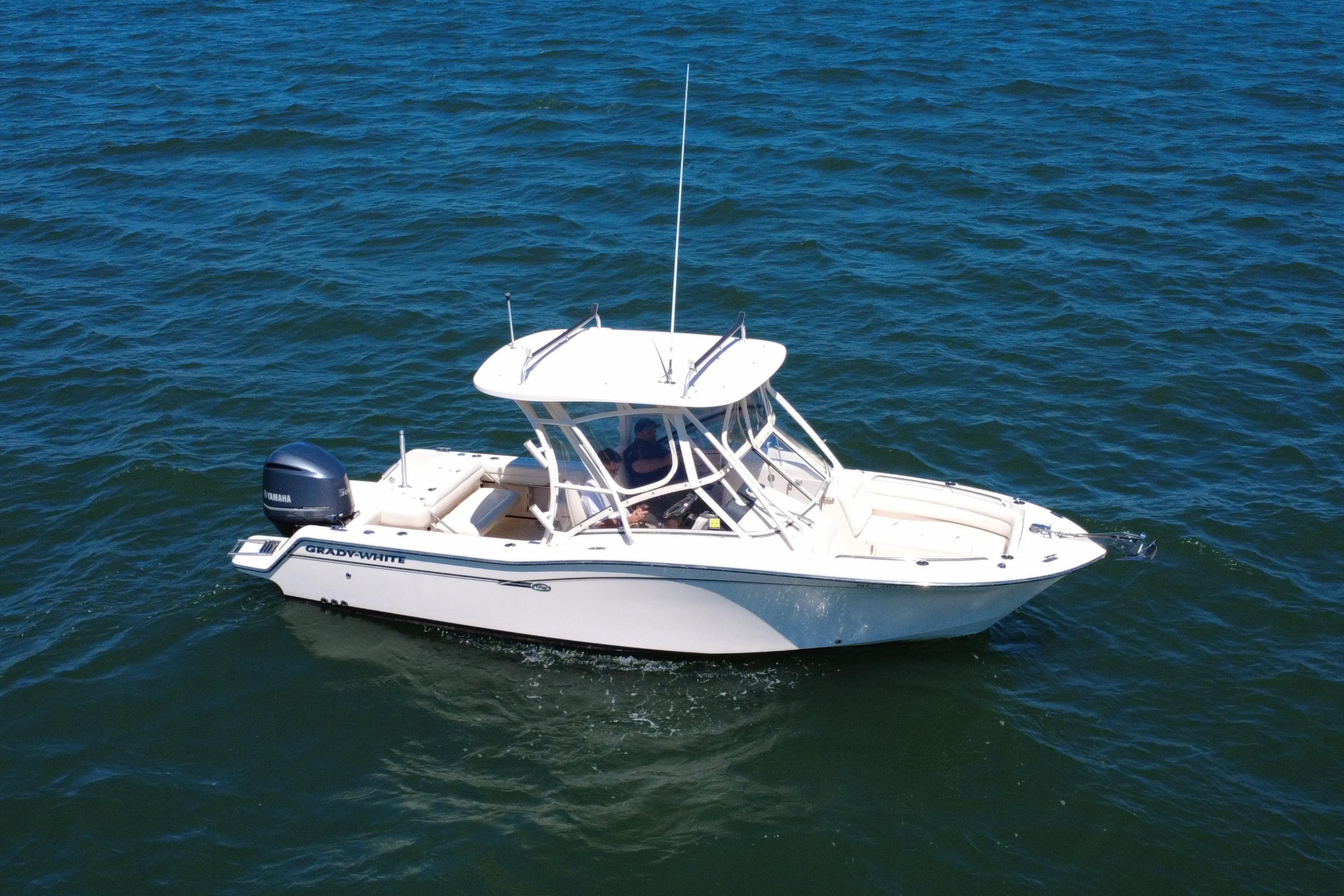 2017 Grady-White Freedom 235 boat cruising on open water.