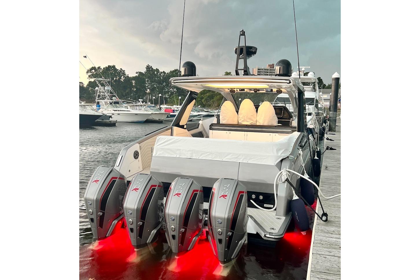 2023 Azimut Verve 47 yacht docked, featuring powerful outboard engines and sleek design.