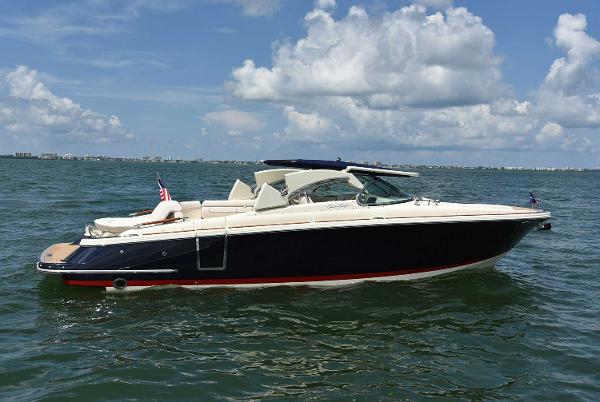 Manufacturer Provided Image: 2019 Chris-Craft Launch 28 GT boat on open water under a blue sky.