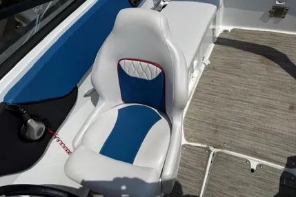Glastron GX210 2021 boat seat with blue and white design.