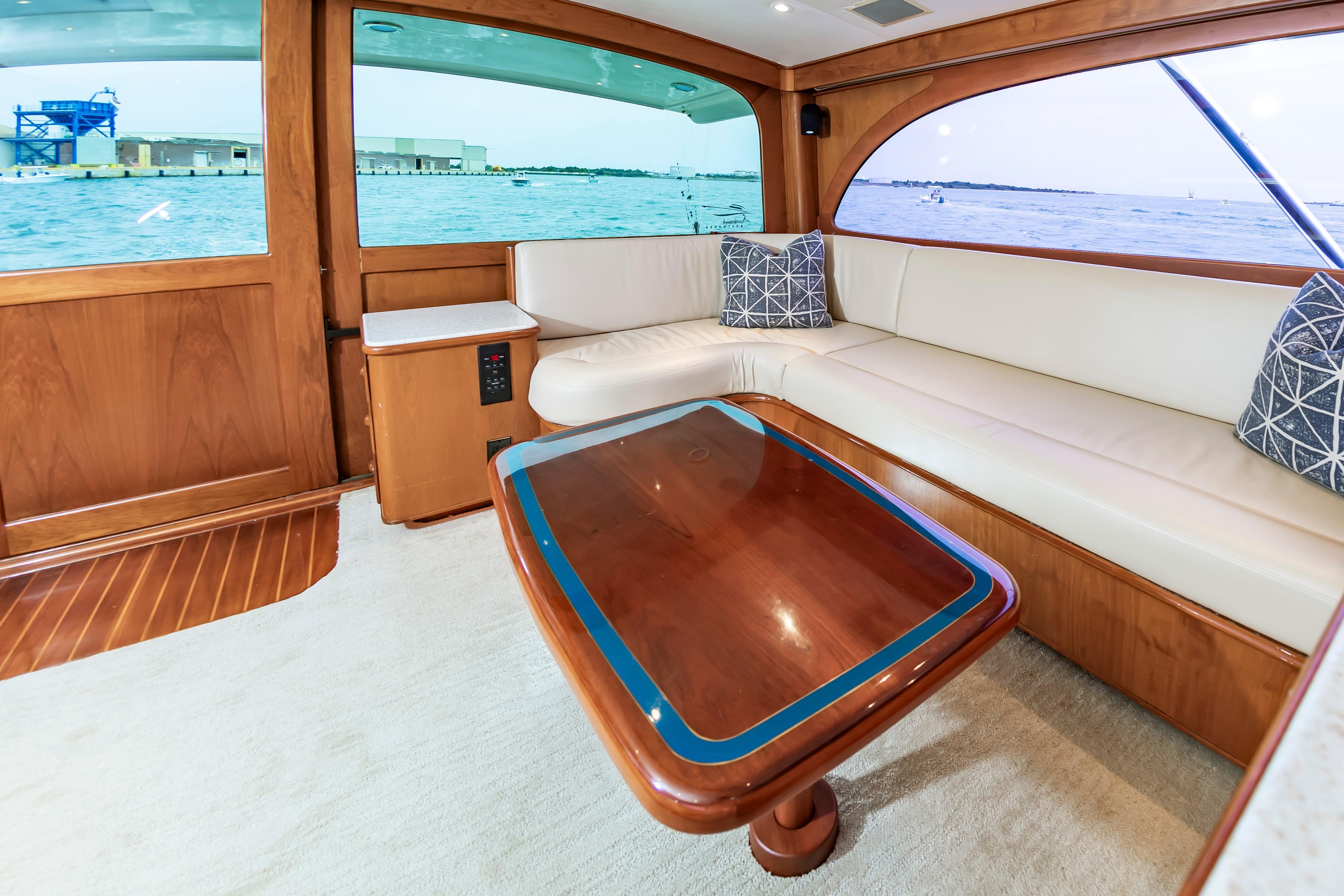 Luxurious interior of 1993 Custom Carolina Scarborough 56 Convertible yacht with elegant wood finishes.