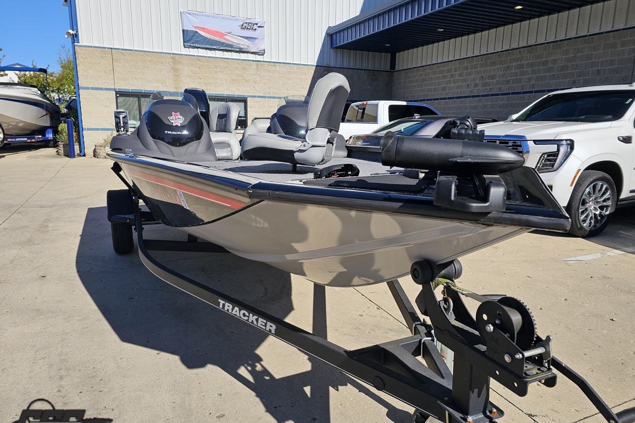 2018 Tracker Pro Team 175 TXW boat on trailer, parked outside dealership.