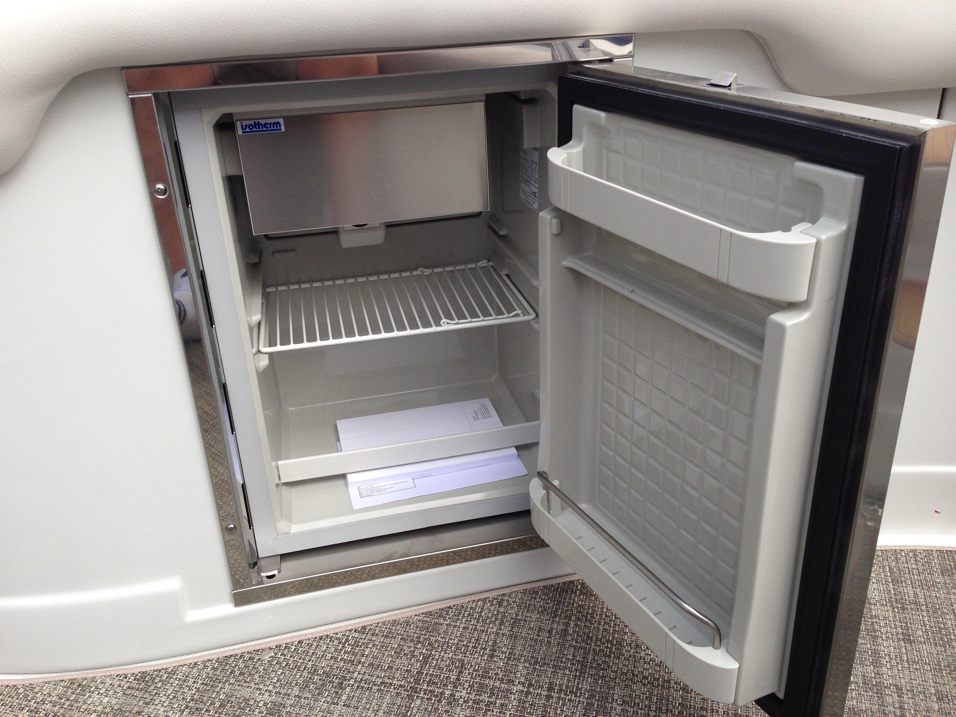 Open refrigerator on a 2016 Crownline 285 SS boat.