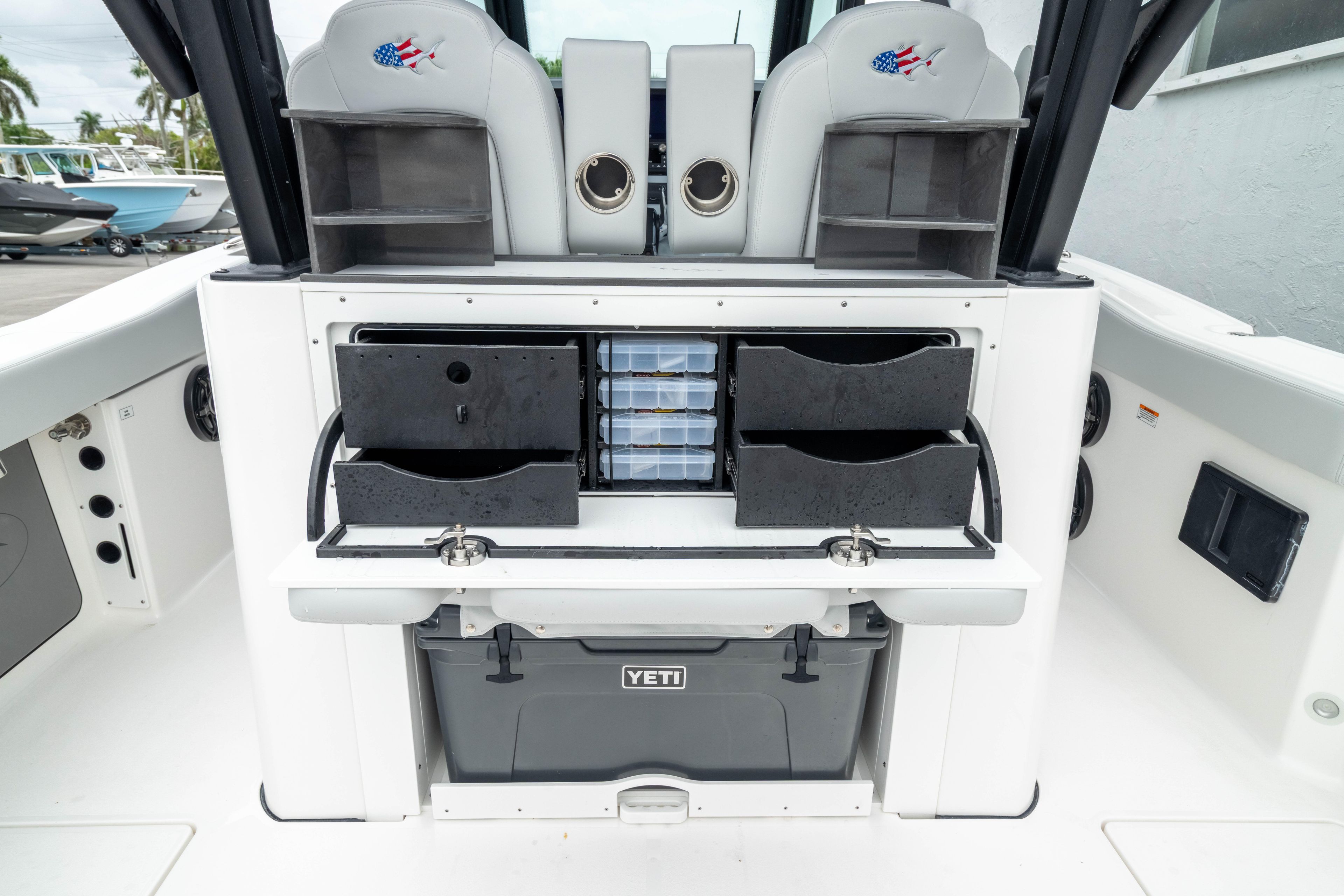 2026 Crevalle 33 CSF boat interior with storage compartments and Yeti cooler.