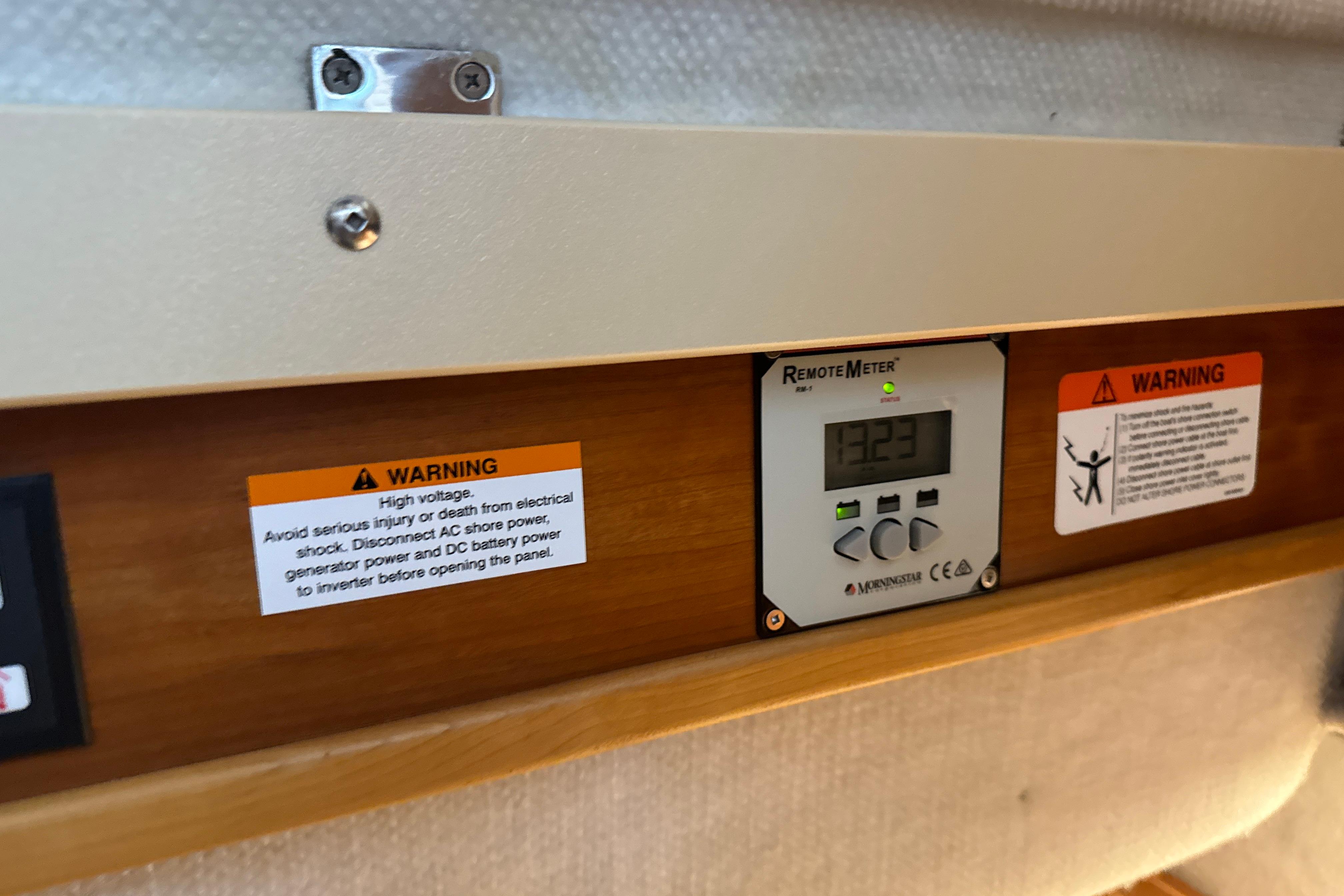 Control panel with warning labels on a 2017 Cutwater C-30 Sedan boat.