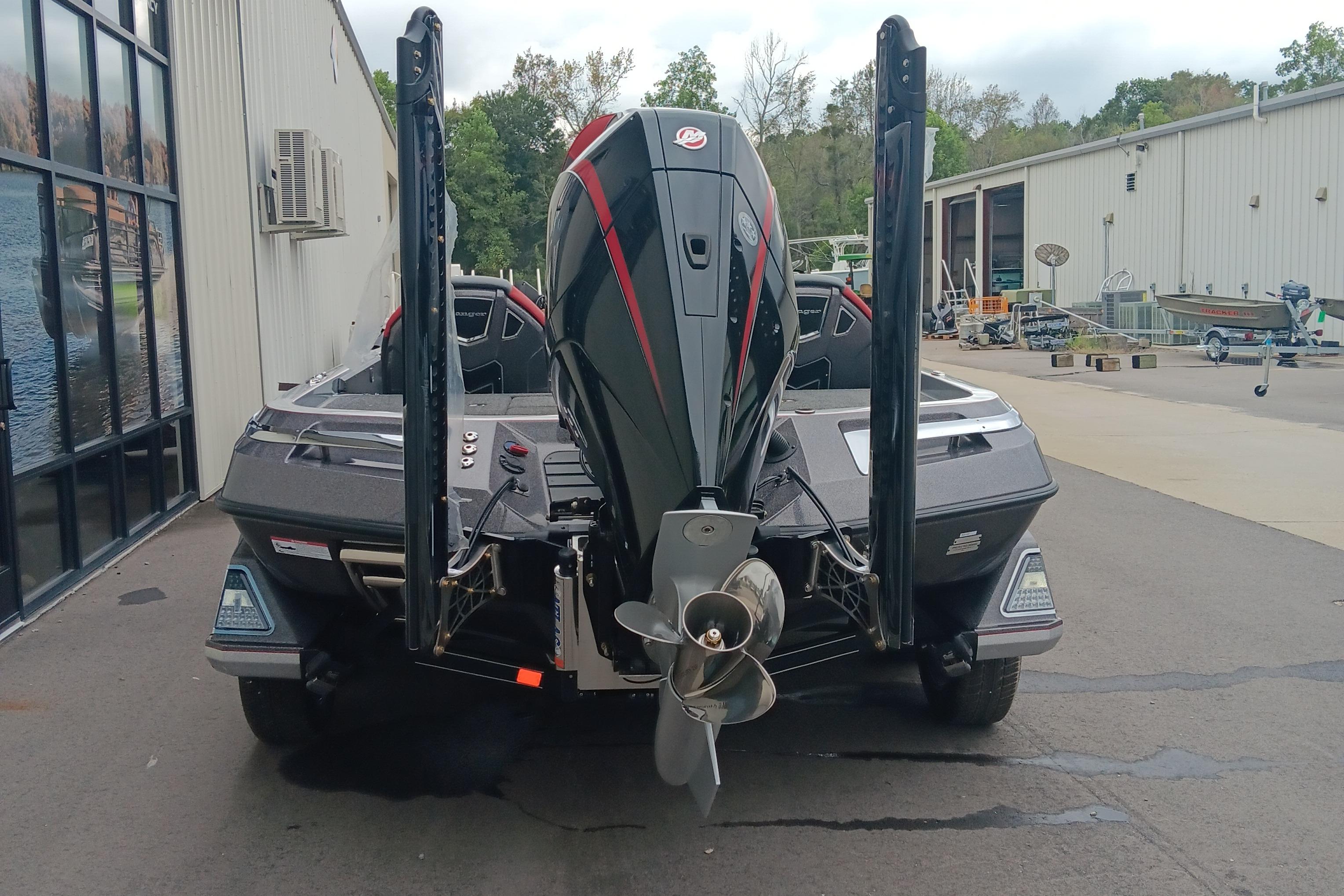 2026 Ranger Z520 boat with powerful outboard motor, parked outside a building.