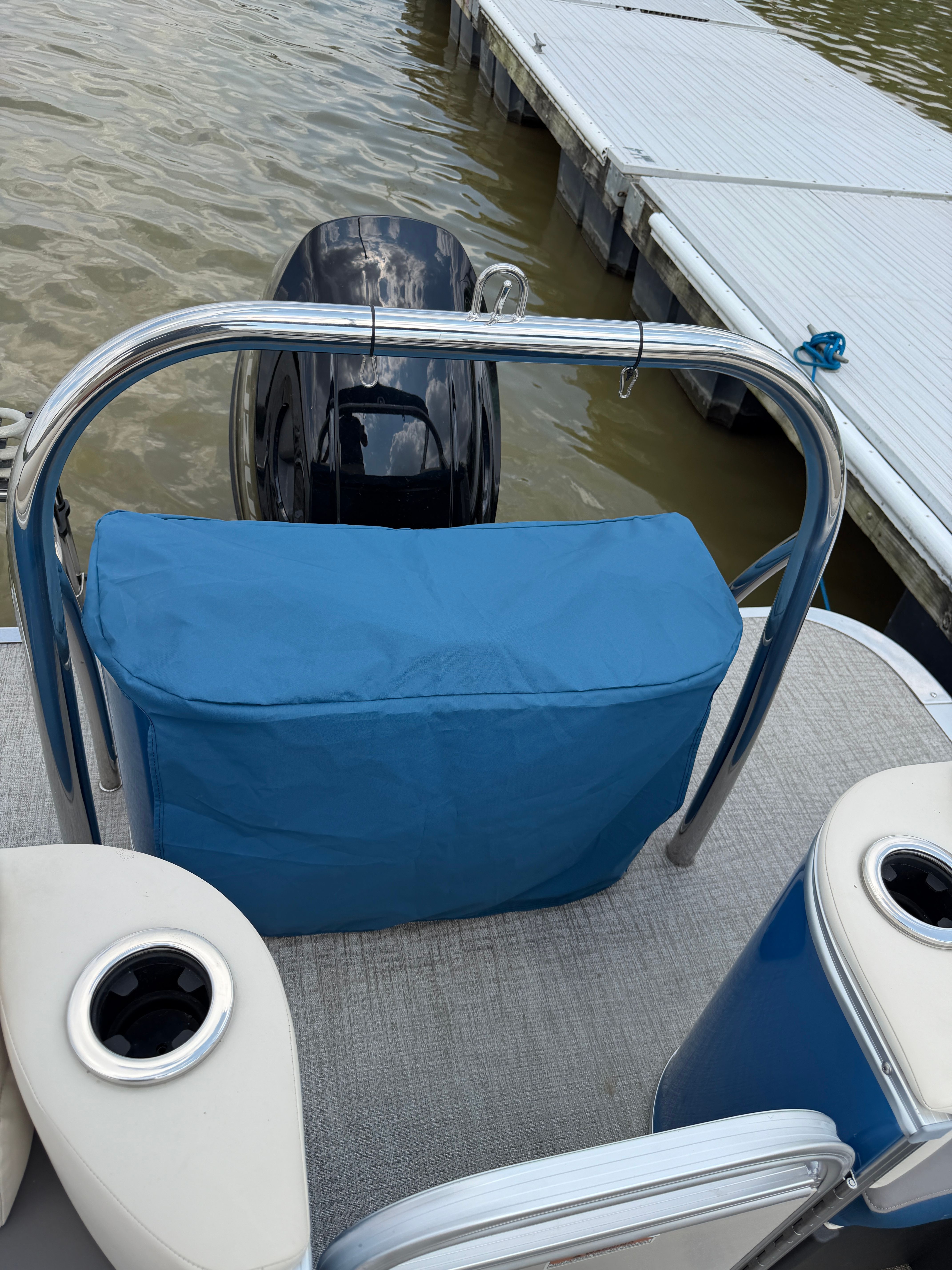 2024 Tahoe Pontoon Cascade Quad Lounger at dock with motor cover.