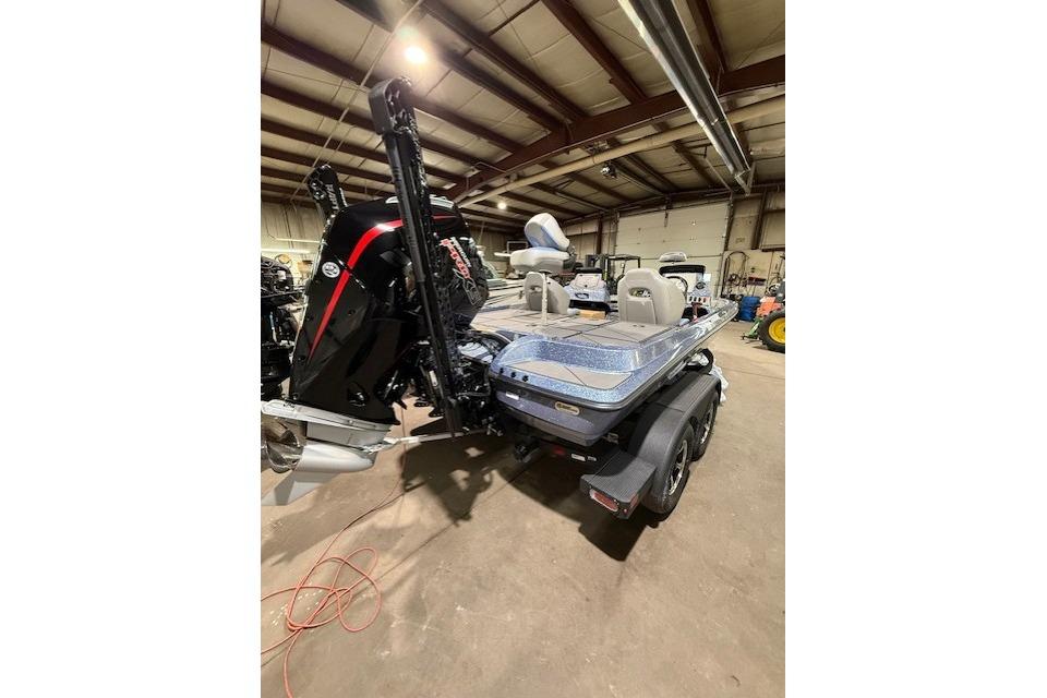 2026 Nitro Z19 XL Pro boat in a warehouse, showcasing rear view and motor.