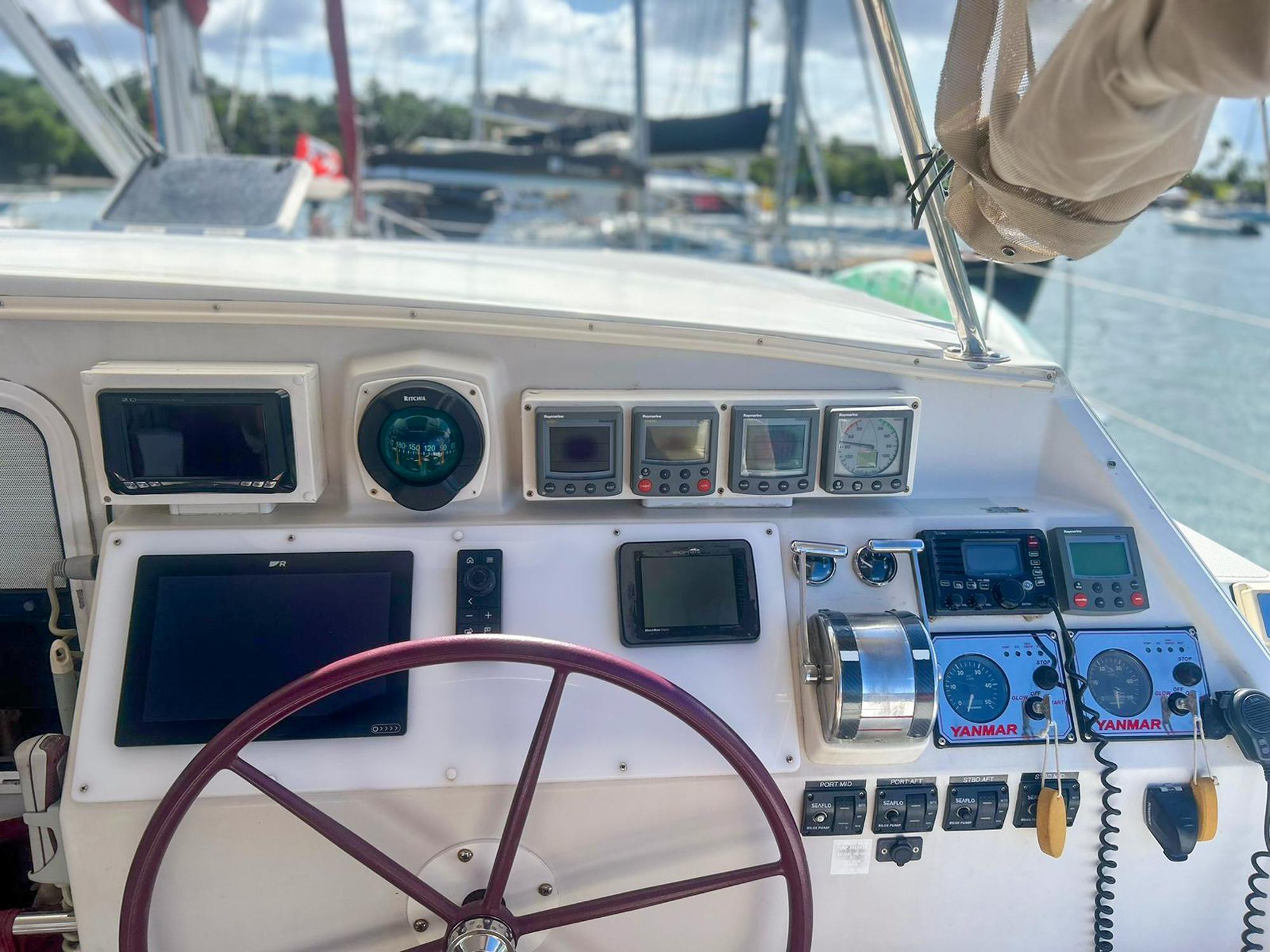 Cockpit of 2005 Antares PDQ 44 yacht with navigation instruments and steering wheel.
