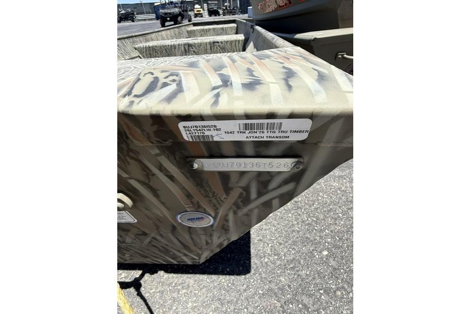 2026 Tracker Grizzly 15 Jon boat with camouflage pattern and identification label.