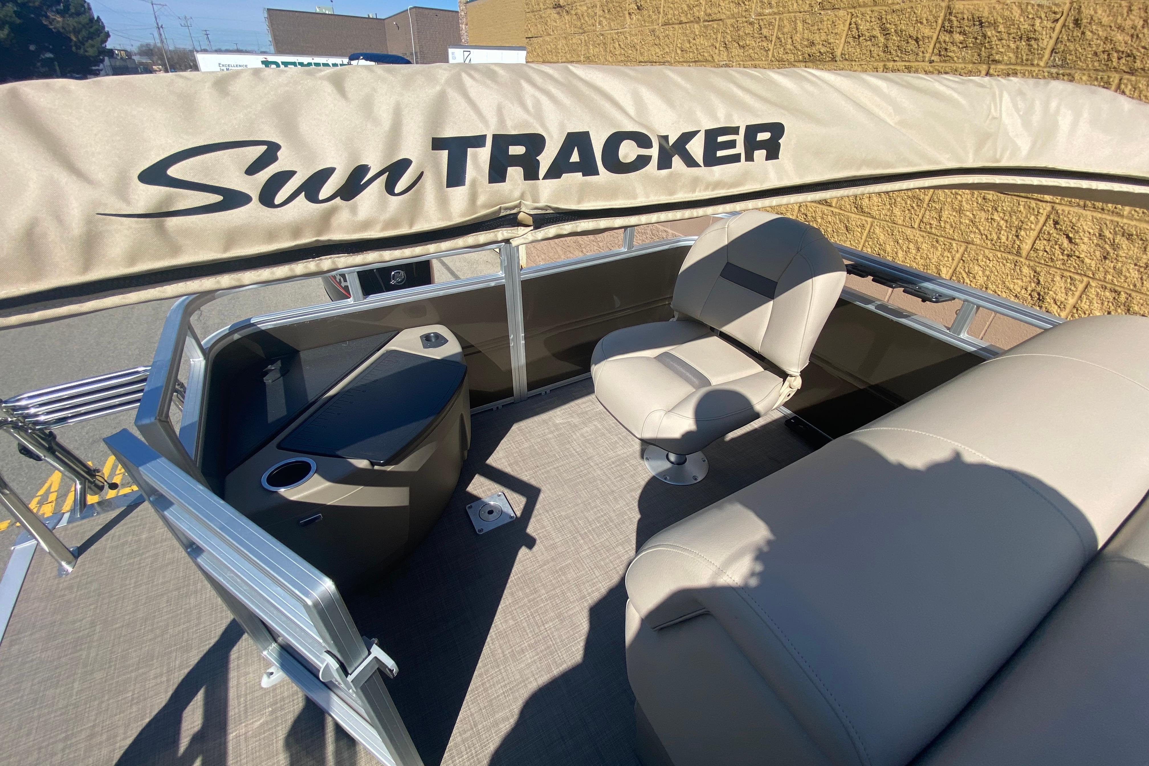 2025 Sun Tracker SportFish 20 DLX pontoon boat interior with seating and console.
