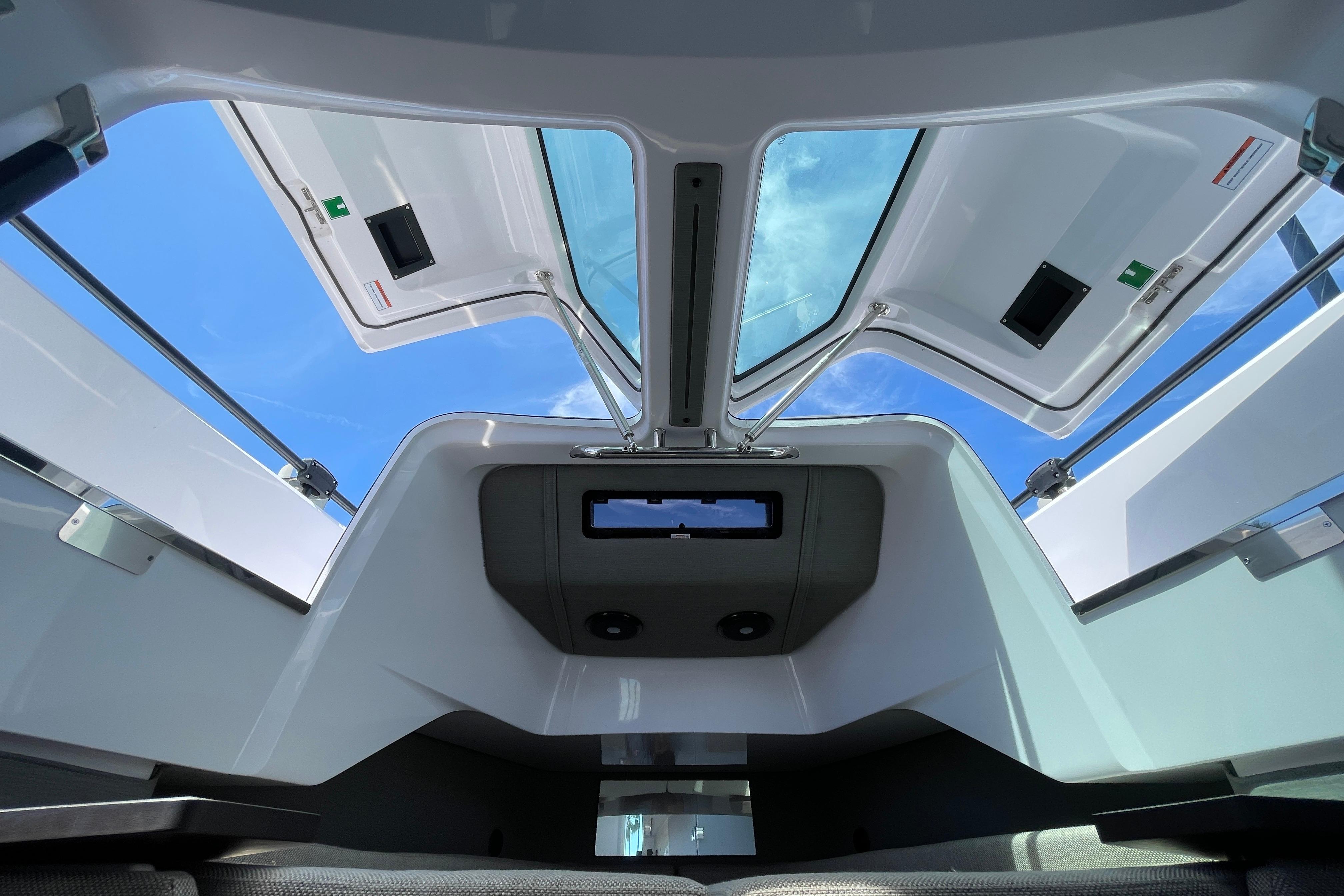 Interior view of 2023 Axopar 37 XC Cross Cabin with open roof hatches.